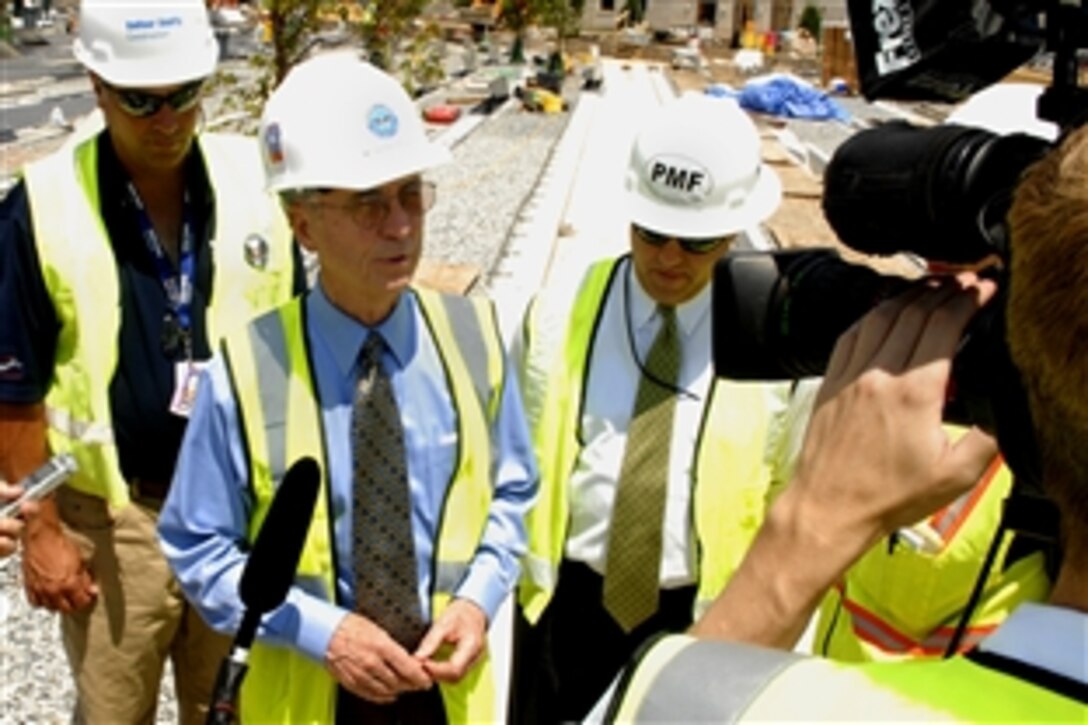 U.S. Deputy Defense Secretary Gordon England gives an interview after participating in the Pentagon Memorial Tree Planting ceremony, June 12, 2008, at the 9/11 Pentagon Memorial construction site.