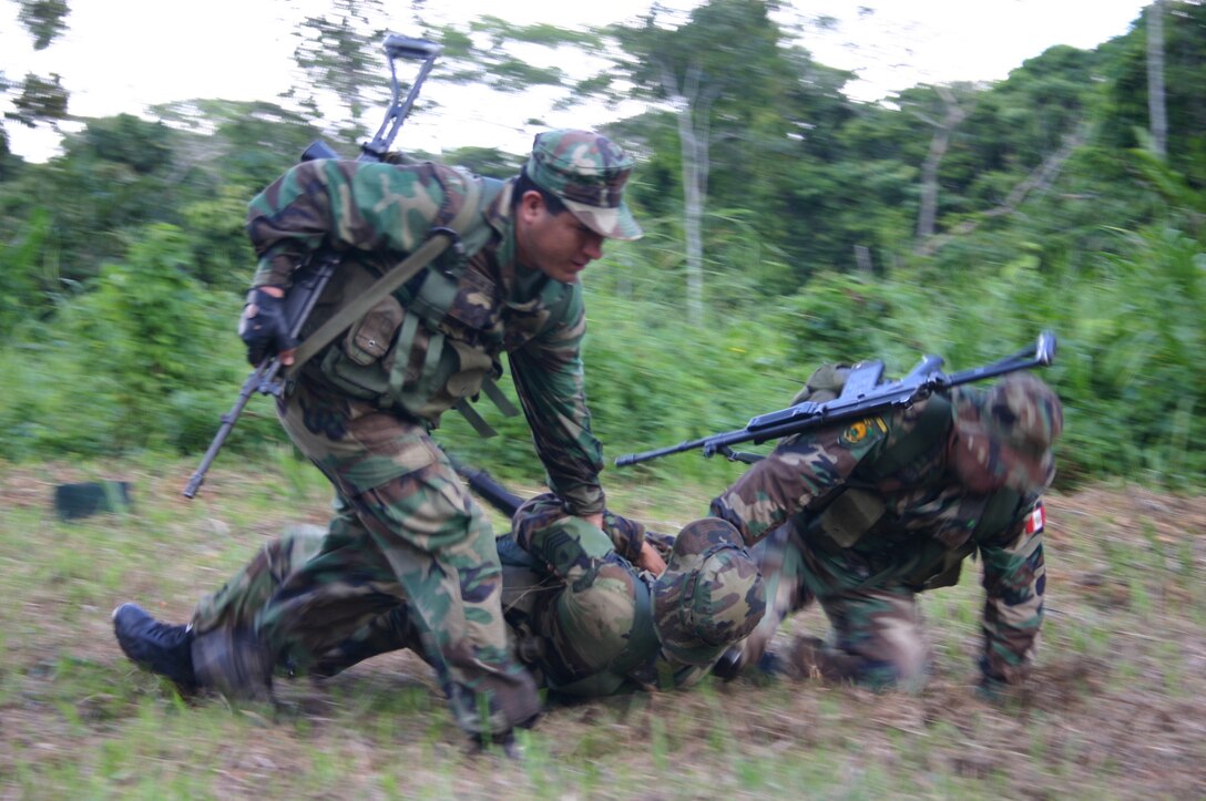 IQUITOS, Peru - Peruvian MArines break contact following a simulated ambush by an enemy sniper.  Peruvian, US and Colombian Marines are jointly training in Iquitos survival and military tactics in the jungle. (Official Marine Corps Photo)