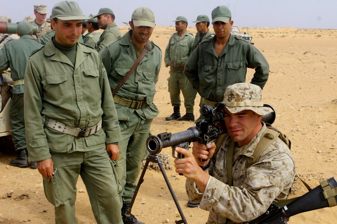 Lance Cpl. Vincent Fischer, a member of Javelin Platoon, Weapons Company, 1st Battalion, 23rd Marine Regiment, practices aiming in on an RPG-7 as Moroccan soldiers oversee. The Marines from took part in a weapons demonstration here with Moroccan armed forces on June 13, as part of African Lion 08, an annual training exercise promoting unit readiness and enhancing foreign relations.