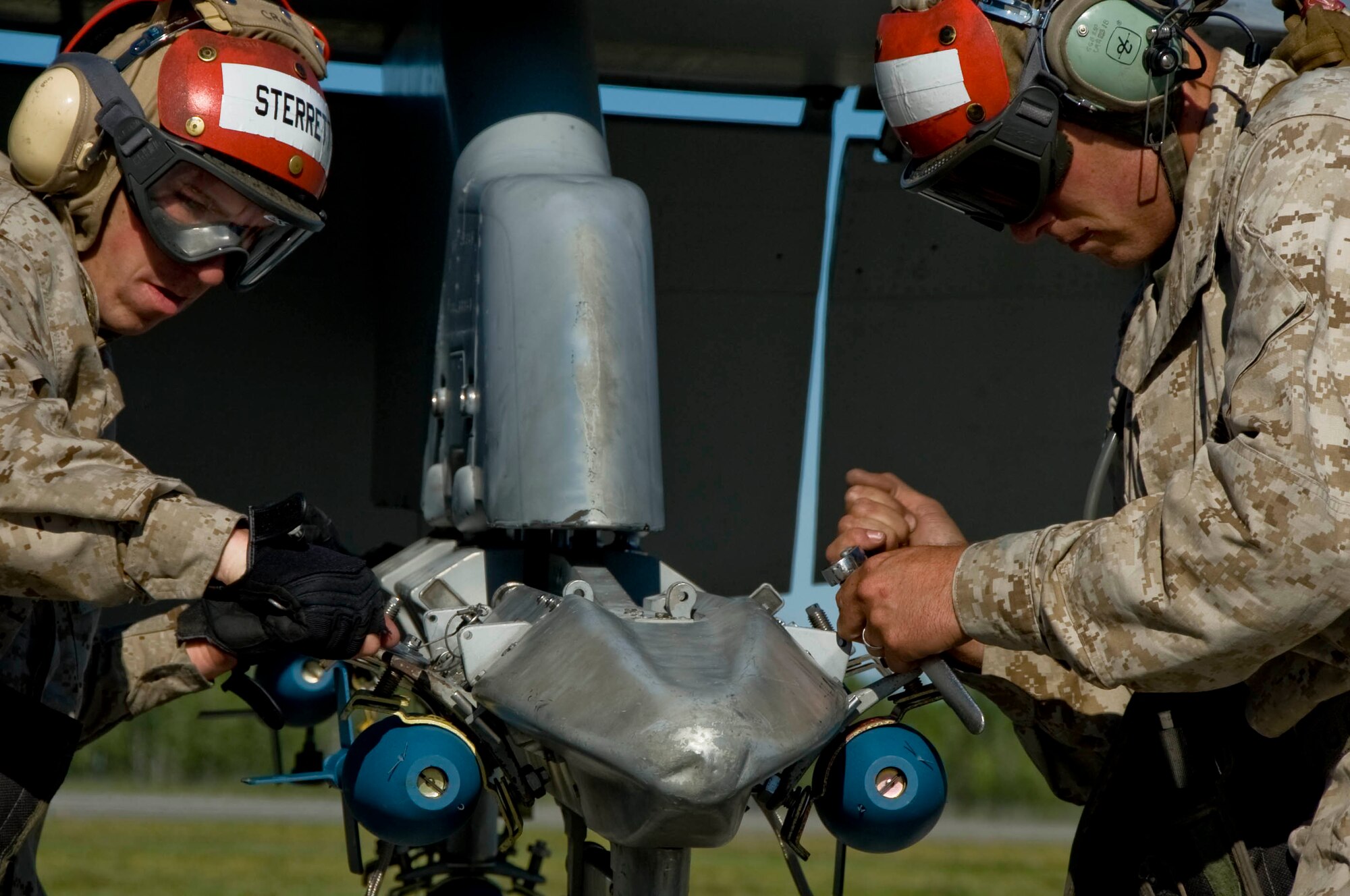 EIELSON AIR FORCE BASE, Alaska -- Lance Cpl. Sterrett and another member of Miramar Naval Air Station load explosive ordinance onto an F-18 Hornet June 13, 2008. The Marines deployed from Miramar are participating in RED FLAG-Alaska 08-3 a series of Pacific Air Forces commander-directed field training exercises for U.S. forces, provides joint offensive counter-air, interdiction, close air support, and large force employment training in a simulated combat environment.  (U.S. Air Force photo by Airman 1st Class Christopher Griffin)