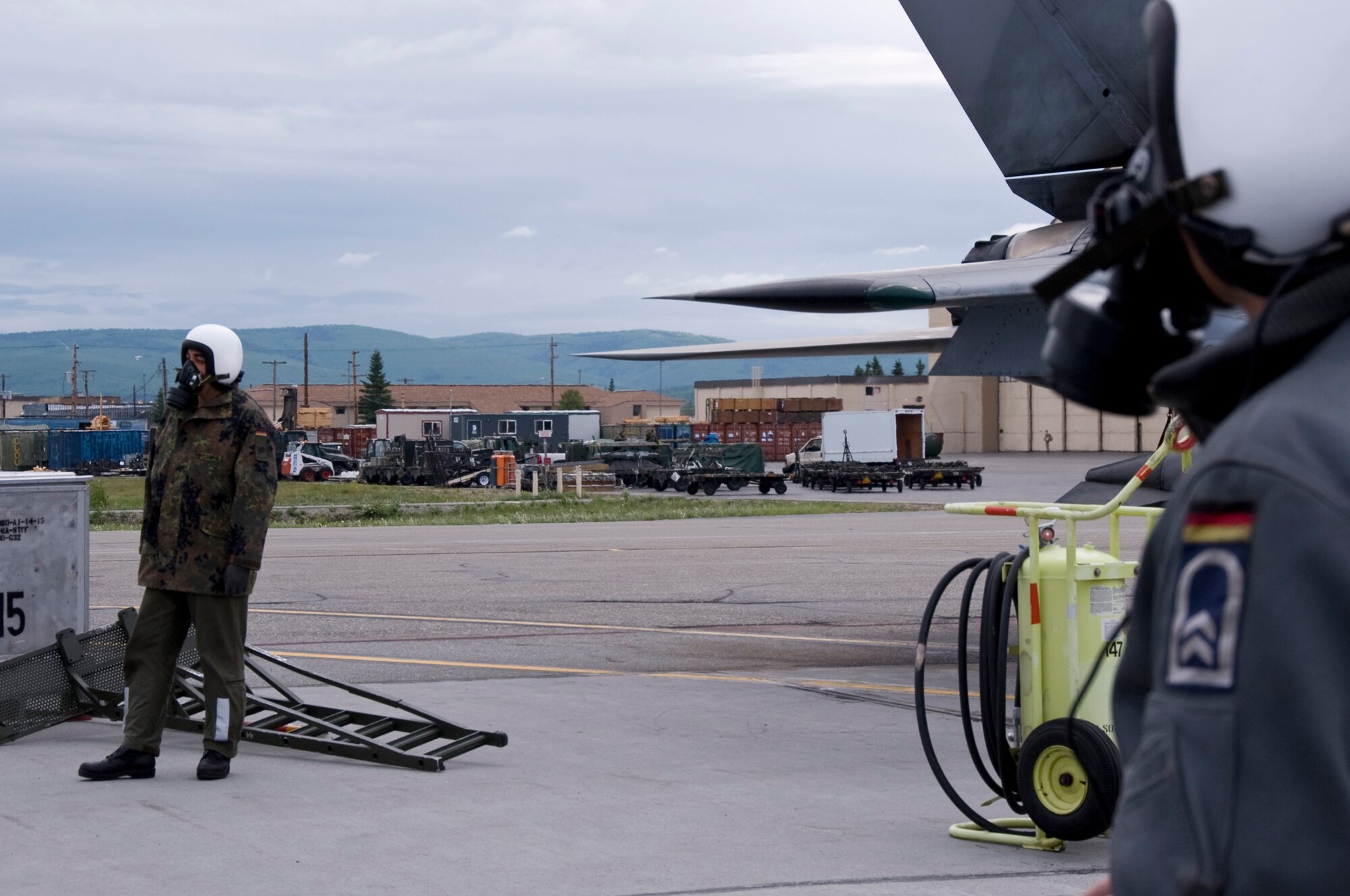 EIELSON AIR FORCE BASE, Alaska --Two German Air Force crew chiefs go through a pre-flight inspection and setup the aircraft before the arrival of the pilots who will be participating in a RED FLAG-Alaska exercise June 12, 2008. The German Air Force has over 10 Tornados currently participating in RED FLAG-Alaska, an exercise where coalition forces come to work in a joint environment in the Pacific Alaskan Range Complex.   (U.S. Air Force photo by Airman 1st Class Christopher Griffin) 