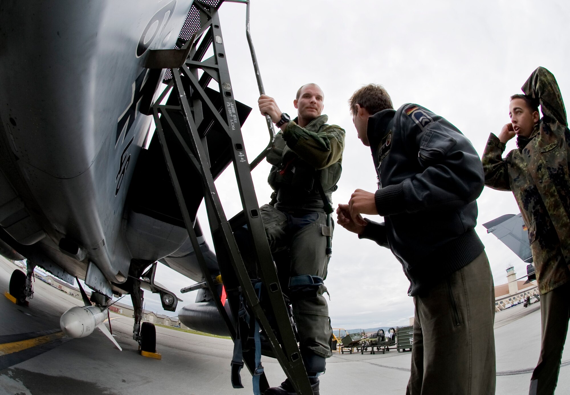 EIELSON AIR FORCE BASE, Alaska --A German Air Force pilot speaks with his crew chief before getting into the cockpit of a Tornado June 12, 2008. . The German Air Force has over 10 Tornados currently participating in RED FLAG-Alaska, an exercise where coalition forces come to work in a joint environment in the Pacific Alaskan Range Complex.    (U.S. Air Force photo by Airman 1st Class Christopher Griffin) 