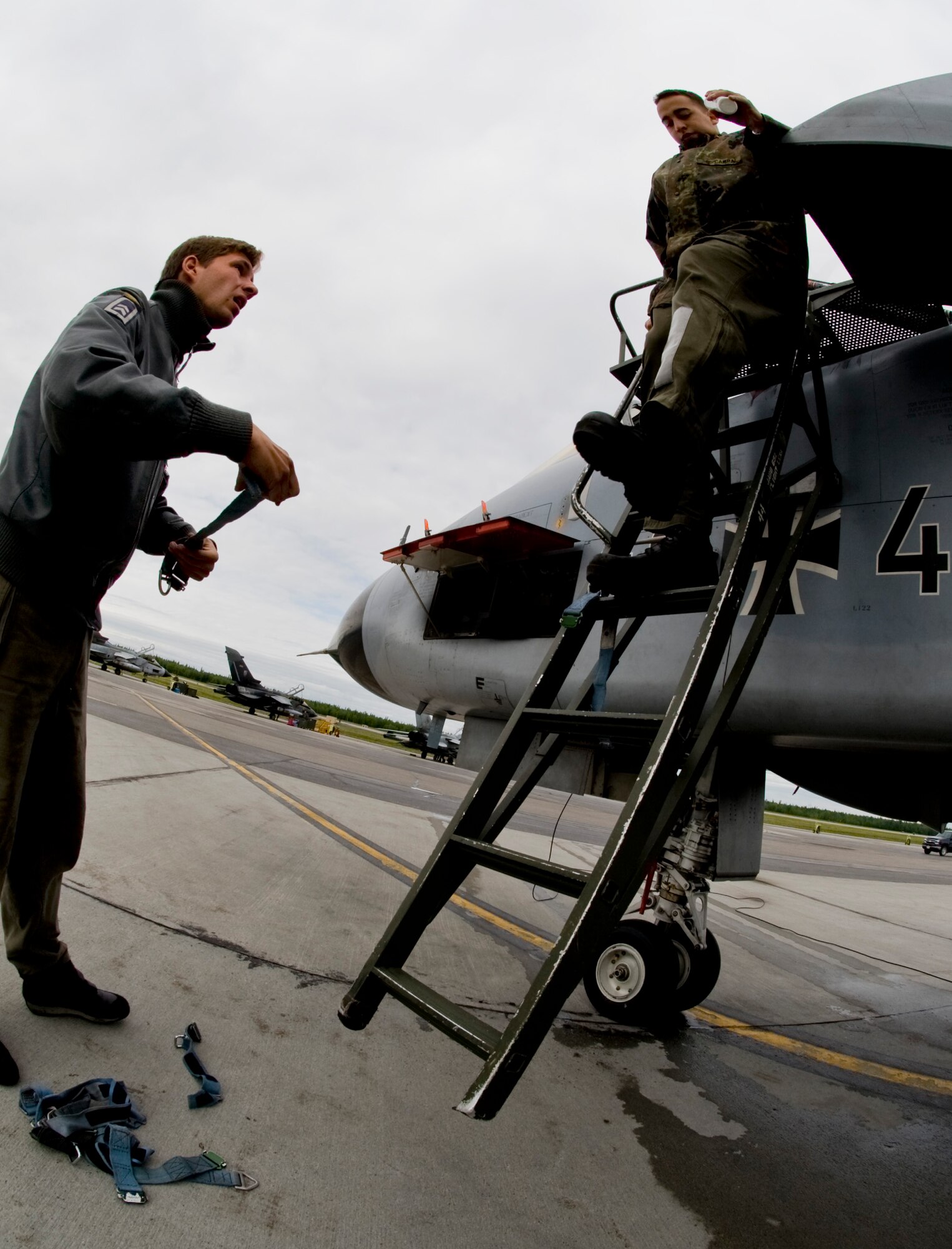 EIELSON AIR FORCE BASE, Alaska --Two German Air Force crew chiefs go through a pre-flight inspection and setup the aircraft before the arrival of the pilots who will be participating in a RED FLAG-Alaska exercise June 12, 2008. The German Air Force has over 10 Tornados currently participating in RED FLAG-Alaska, an exercise where coalition forces come to work in a joint environment in the Pacific Alaskan Range Complex.  (U.S. Air Force photo by Airman 1st Class Christopher Griffin) 