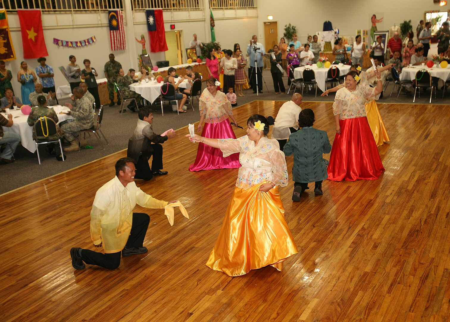 5/27/2008 - Members of Team Lackland dance during the Asian/Pacific Islander food tasting at Arnold Hall May 27.  More than 400 people came out to sample food and watch dancing, martial arts and sumo demonstrations.  
(USAF photo by Robbin Cresswell)