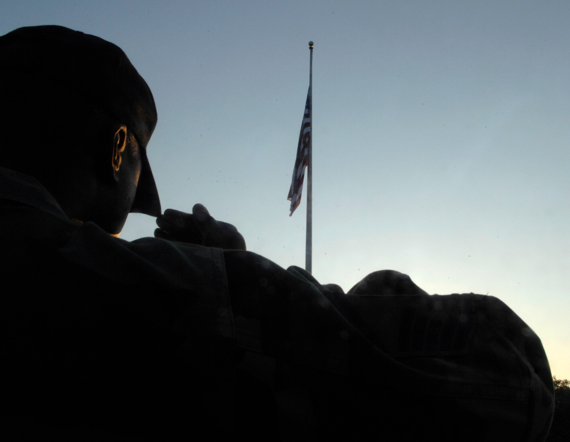 Master Sgt. Alan Williams, 316th Wing Public Affairs superintendent, renders a salute to the flag in honor of National Flag Day on June 13.  Flag Day commemorates the adoption of the flag of the United States originating in 1777. (U.S. Air Force photo/Senior Airman Steven R. Doty)
