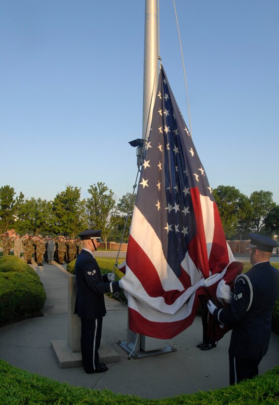 Members from the Andrews Air Force Base Honor Guard prepare to raise the flag in honor of National Flag Day on June 13.  Flag Day commemorates the adoption of the flag of the United States originating in 1777. (U.S. Air Force photo/Senior Airman Steven R. Doty)