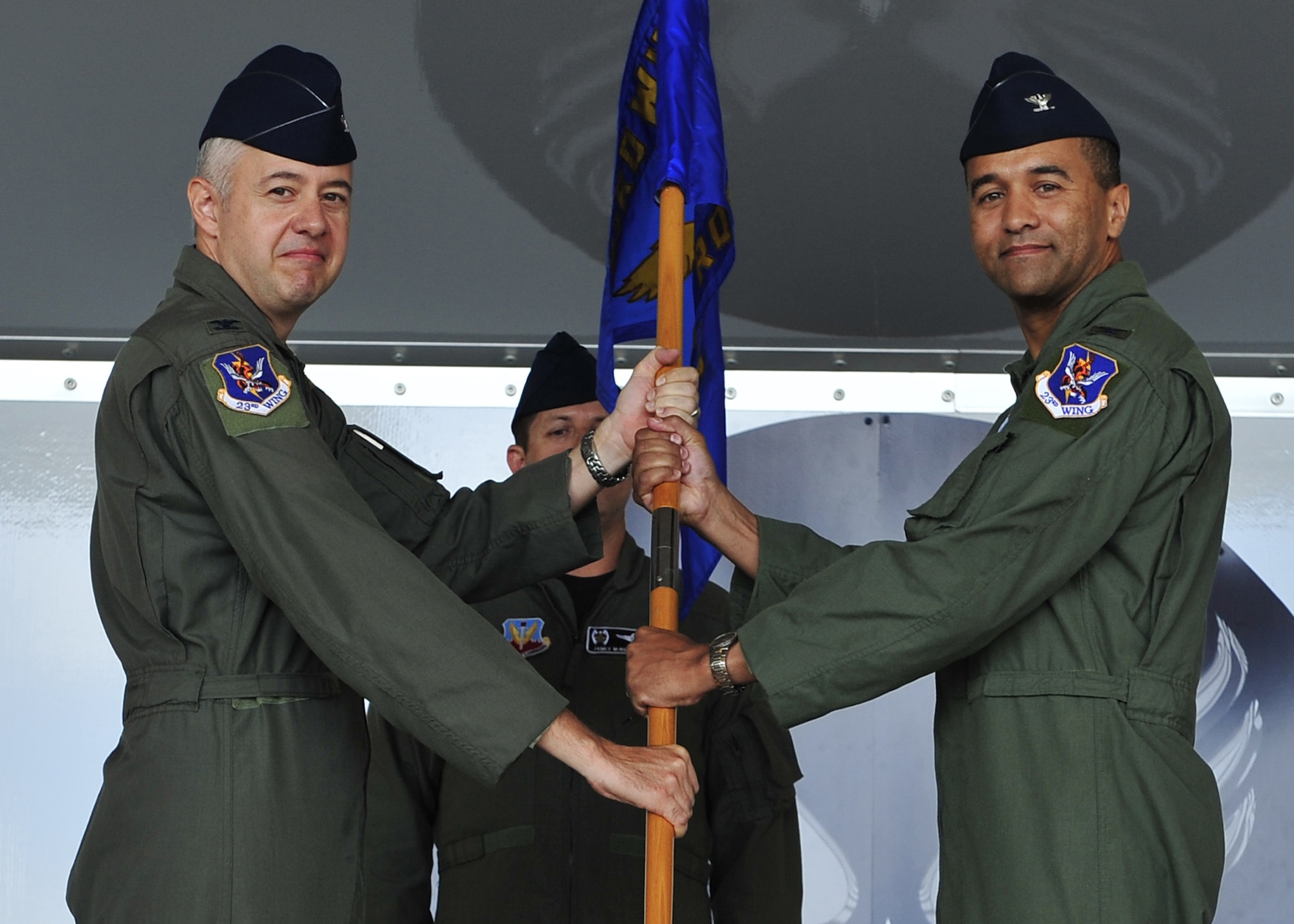MOODY AIR FORCE BASE, Ga. -- Col. Kenneth Todorov, 23rd Wing commander, passes the guideon to Col. Darryle Grimes, 347th Rescue Group commander, during a
change-of-command ceremony here June 13.  Colonel Grimes assumed command of
the group from Col. Eric Kivi who commanded the group for the past two
years. (U.S. Air Force photo by Senior Airman Elizaberth Rissmiller)
