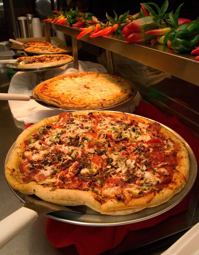 LANGLEY AIR FORCE BASE, Va. -- Langley first sergeants served pizza at the Eagle Dining Facility here June 12.  Langley first sergeants often volunteer to serve pizza every Thursday. (U.S. Air Force photo/Senior Airman Barry Loo)

