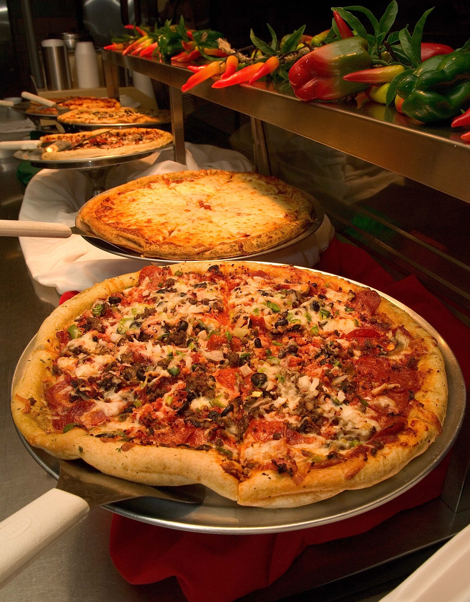 LANGLEY AIR FORCE BASE, Va. -- Langley first sergeants served pizza at the Eagle Dining Facility here June 12.  Langley first sergeants often volunteer to serve pizza every Thursday. (U.S. Air Force photo/Senior Airman Barry Loo)

