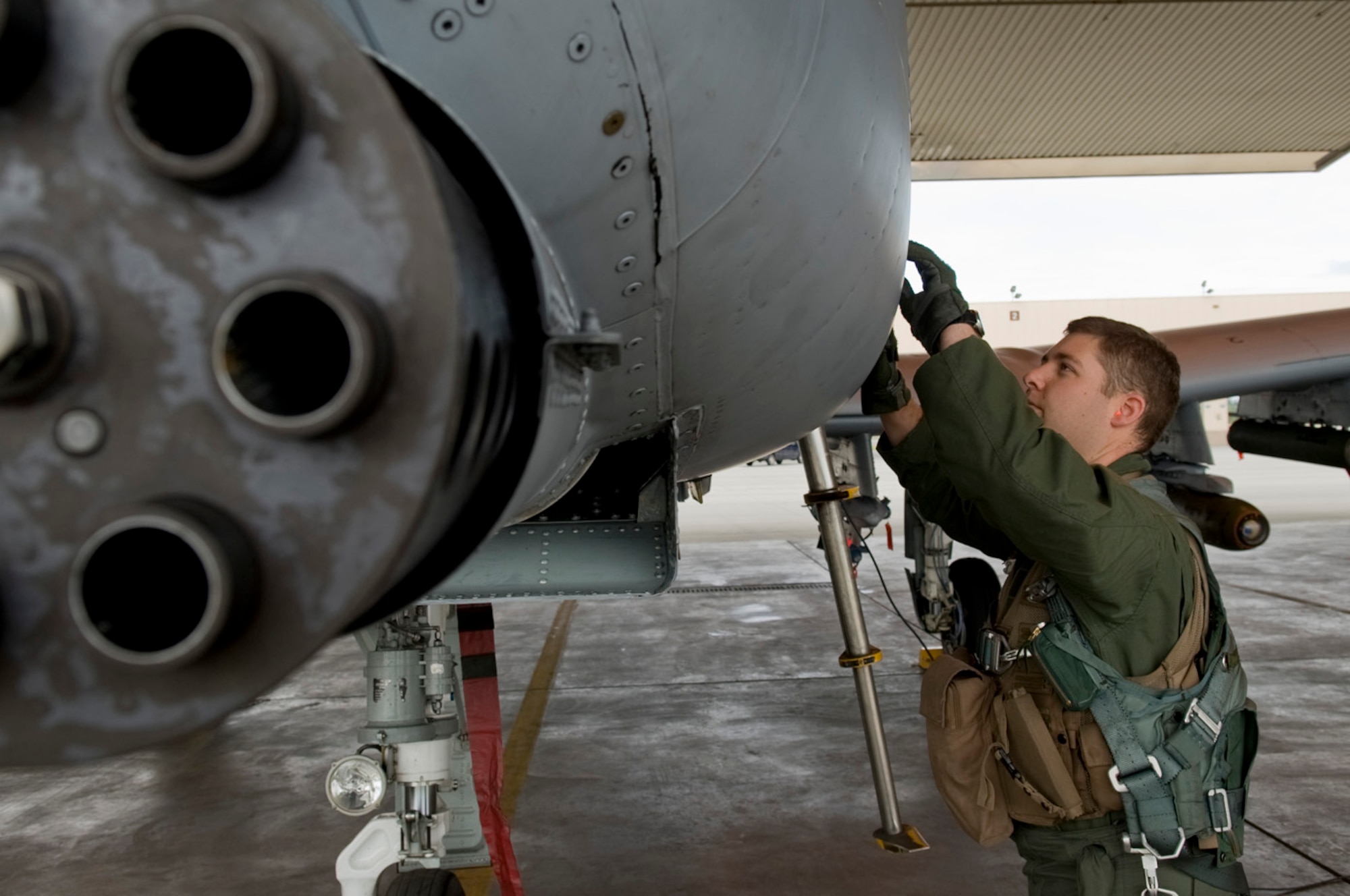 Capt. Aaron McEwen conducts a pre-flight inspection June 12, 2008, at Eielson Air Force Base, Alaska during RED FLAG-Alaska 08-3. This a series of Pacific Air Forces commander-directed field training exercises for U.S. forces, provides joint offensive counter-air, interdiction, close air support, and large force employment training in a simulated combat environment. He is assigned to the 25th Fighter Squadron at Osan Air Base, Korea. (U.S. Air Force Photo/Airman 1st Class Jonathan Snyder)