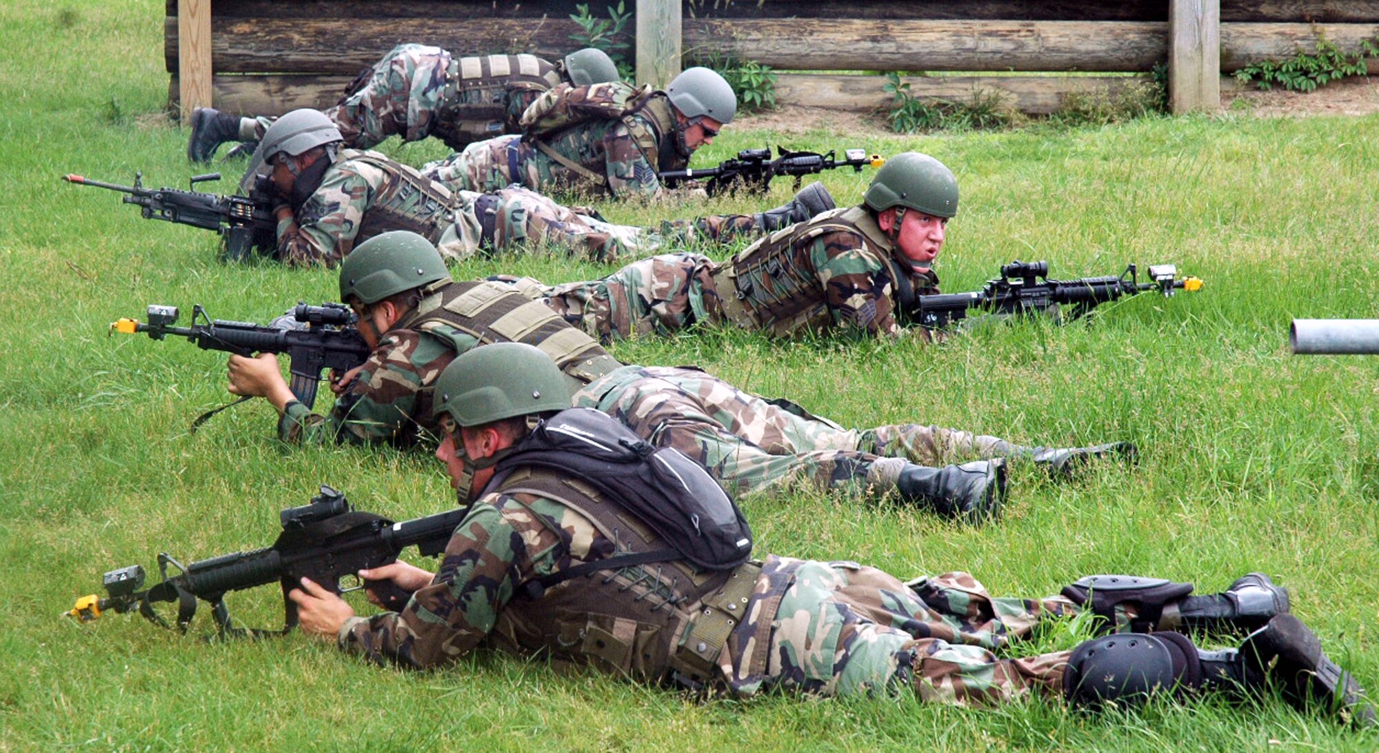Students in the Air Force Phoenix Warrior Training Course 08-5 provide security during training in a combat first aid class on a Fort Dix, N.J., range June 5, 2008.  The course is taught by the U.S. Air Force Expeditionary Center's Expeditionary Operations School and 421st Combat Training Squadron and prepares security forces Airmen for upcoming deployments. Annually, the USAF EC trains more than 23,000 students in expeditionary- and mobility air force-based courses both with in-residence and distance learning.  (U.S. Air Force Photo/Tech. Sgt. Scott T. Sturkol)
