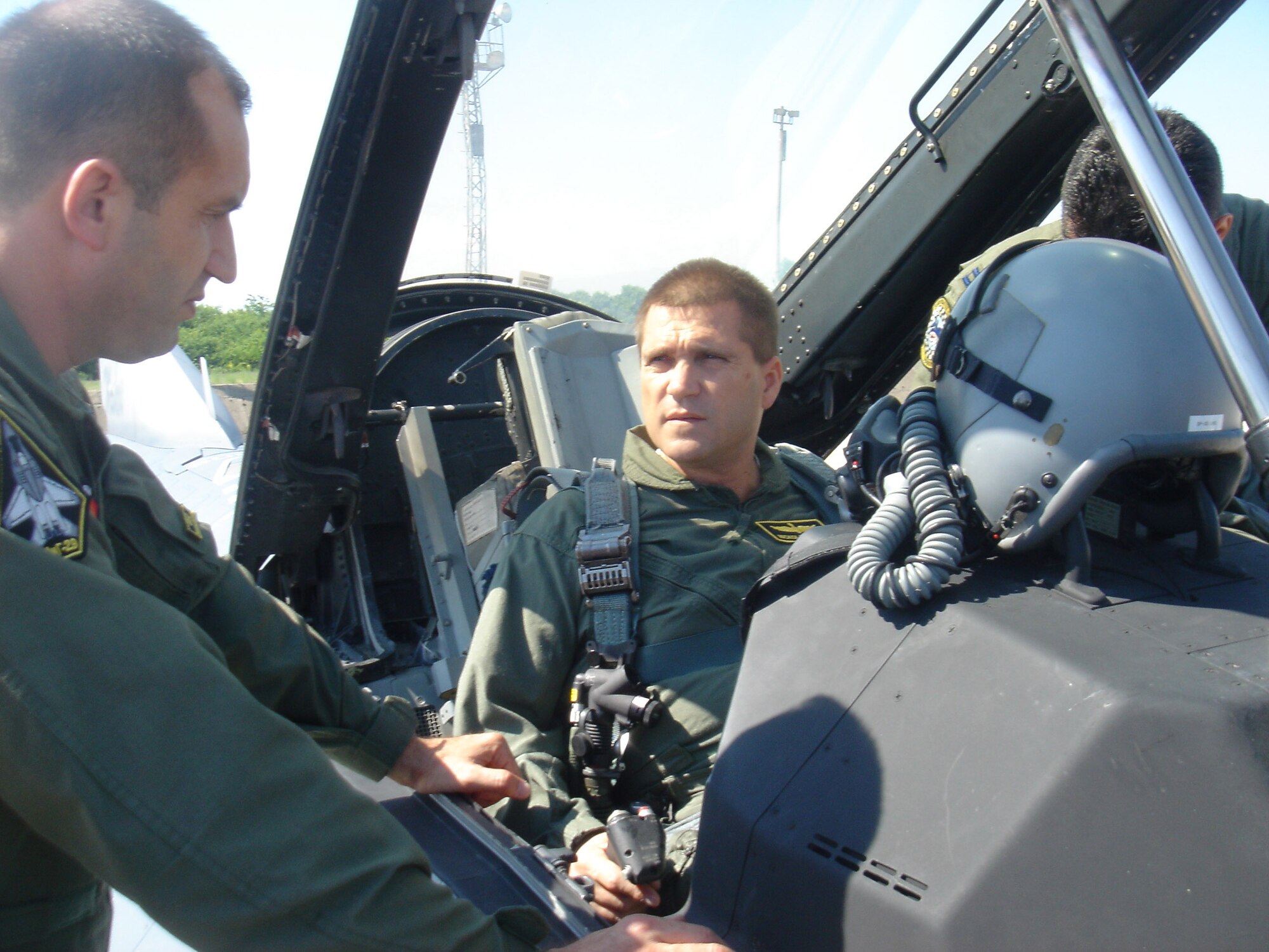 Bulgarian Defense Minister Nikolay Tsonev (left) talks with Bulgarian Gen. Rumen Radev before the defense minister takes a ride on a U.S. F-16 Fighting Falcon June 11 at Graf Ignatievo Air Base, Bulgaria. American aircrews and 10 F-16s from the 93rd Fighter Squadron at Homestead Air Reserve Base, Fla., are at Graf Ignatievo AB to particpate in a joint drill with 15 Bulgarian MiG-21 and MiG-29 fighters. MInister Tsenov visited the base to see how the joint drill was progressing. General Radev is the Graf Ignatievo AB commander. (Courtesy photo/Darik Plovdiv) 
