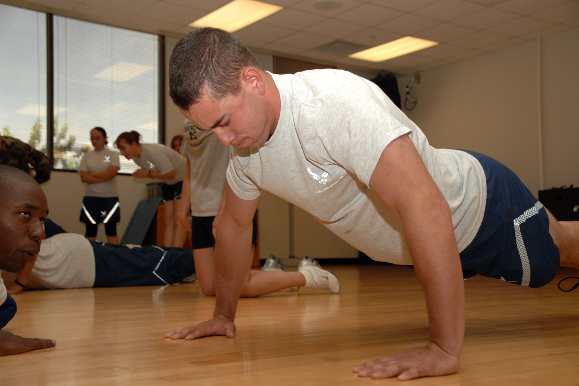 Airman Christopher Carey, 49th Civil Engineer Squadron, performs push-ups during the Team Iron Airman Challenge June 11 at the Fitness and Sports Center at Holloman Air Force Base, N.M. Participants had one minute to complete as many push-ups as possible. (U.S. Air Force photo/Airman 1st Class Jamal D. Sutter)