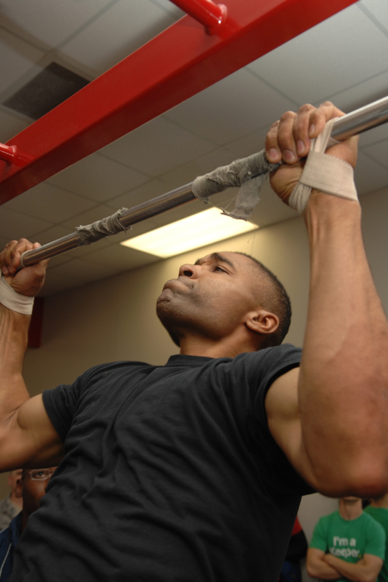 Master Sgt. Shunne Elerby, 49th Civil Engineers Squadron, performs pull-ups during the Team Iron Airman Challenge June 11 at the Fitness and Sports Center at Holloman Air Force Base, N.M. Sergeant Elerby completed 28 pull-ups. (U.S. Air Force photo/Airman 1st Class Jamal D. Sutter)