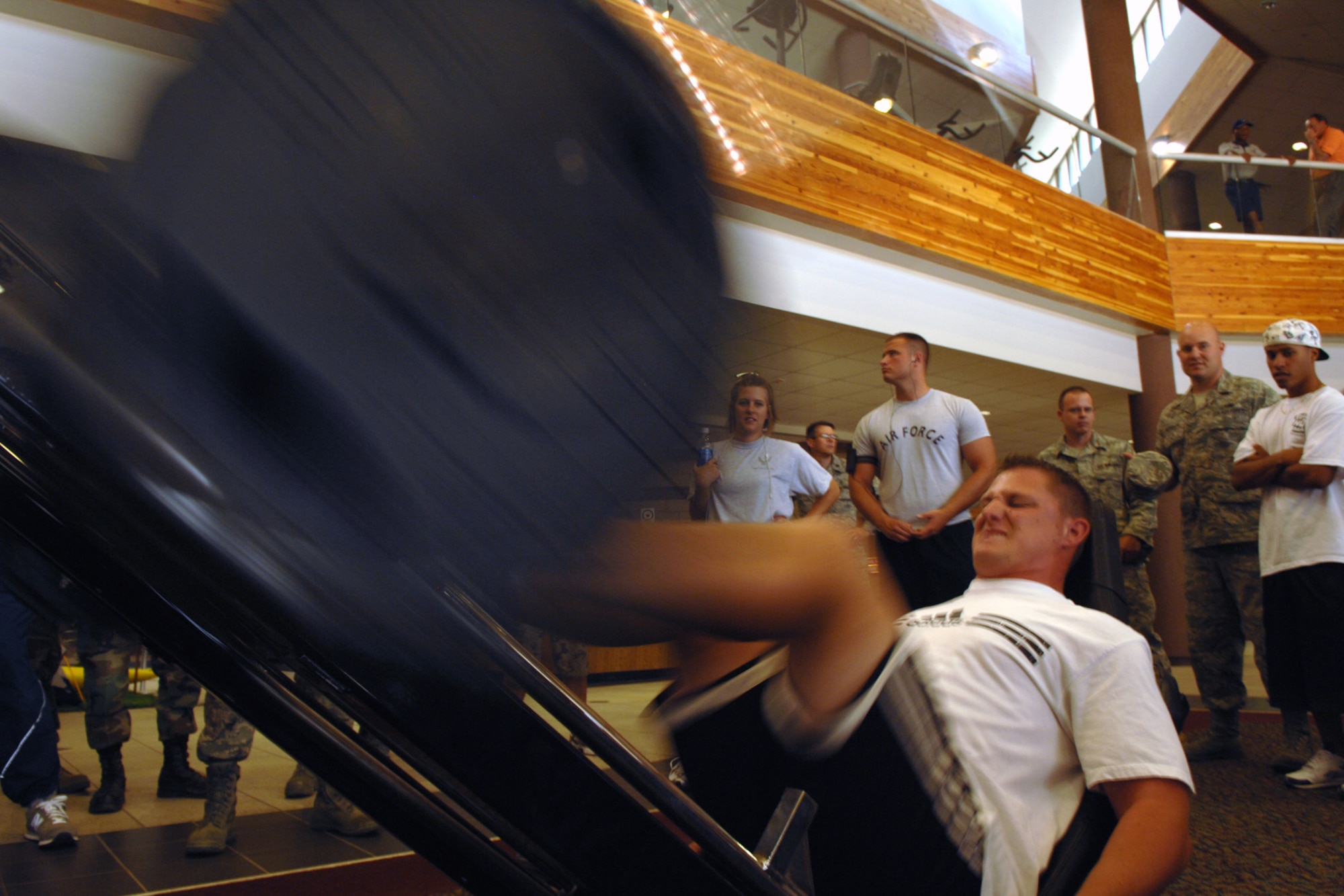 Airman 1st Class Javan Belher, 49th Maintenance Squadron, performs leg presses during the Team Iron Airman Challenge June 11 at the Fitness and Sports Center at Holloman Air Force Base, N.M. Airman Behler completed 75 repetitions at 405 pounds. (U.S. Air Force photo/Airman 1st Class Jamal D. Sutter)