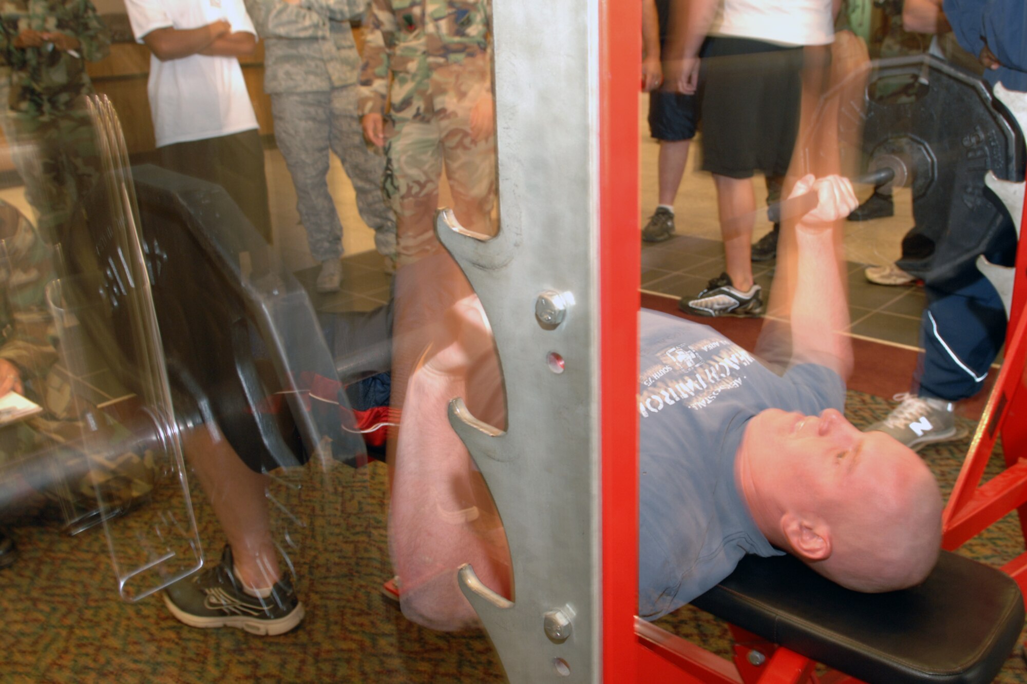 Airman 1st Class Erich Rusk, 49th Civil Engineer Squadron, bench presses during the Team Iron Airman Challenge June 11 at the Fitness and Sports Center at Holloman Air Force Base, N.M. Airman Rusk completed 35 repetitions at 135 pounds. (U.S. Air Force photo/Airman 1st Class Jamal D. Sutter)