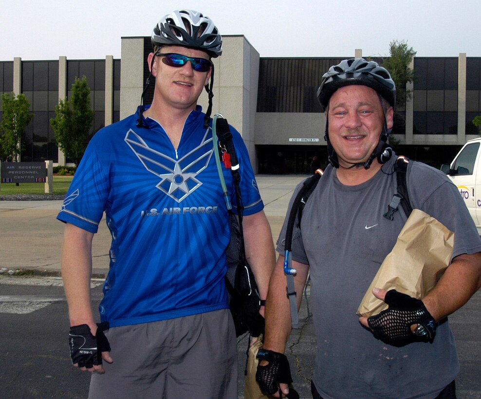 Tech. Sgt. Ryan Phipps and Master Sgt. Bryan Litke, right, participated in last year's Bike to Work Day at the Air Reserve Personnel Center. Bike to Work Day is June 25. To register, visit www.drcog.org/btwd2008/ . (U.S. Air Force photo/Mike Molina)                                
