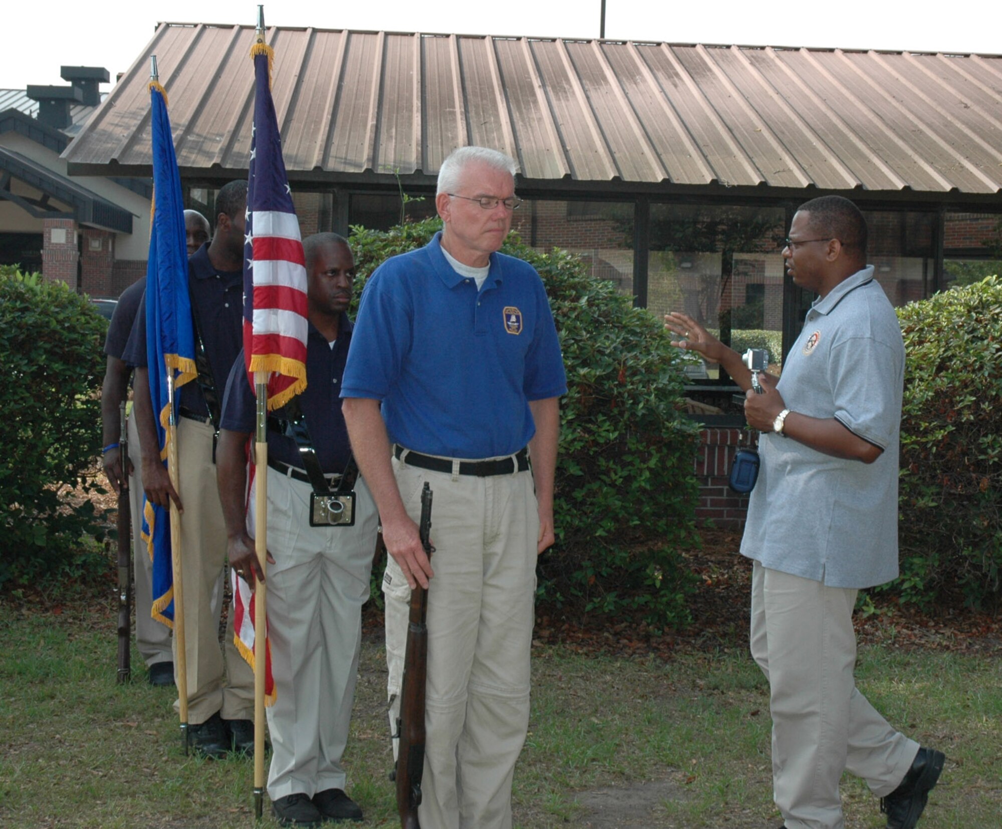 Tech. Sgt. Dennis Washington (right), a reservist with the 315th Airlift Wing honor guard, instructs members of the Charleston Police Department.  Sergeant Washington, also a police officer trained the police honor guard on proper honor guard procedures.  (Photo by Tanya Trejo, USAFR)