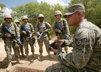 6/9/2008 - Staff Sgt. Andrew Crabtree, 37th Training Support Squadron, discusses a simulated explosive with basic trainees.  Each time students encounter a simulated explosive, instructors analyze and discuss it with the training group, covering the specific location, type and situation to heighten IED awareness.
(USAF photo by Robbin Cresswell)