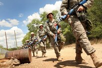 6/9/2008 - Basic trainees look for Improvised Explosive Devices along Lackland's IED Training Lane.  Since January 2008, an IED training plan within the Chemical, Biological, Radiological, Nuclear and Explosives course of Basic Military Training has prepared Lackland trainees for potential IED risks during deployments.
(USAF photo by Robbin Cresswell)