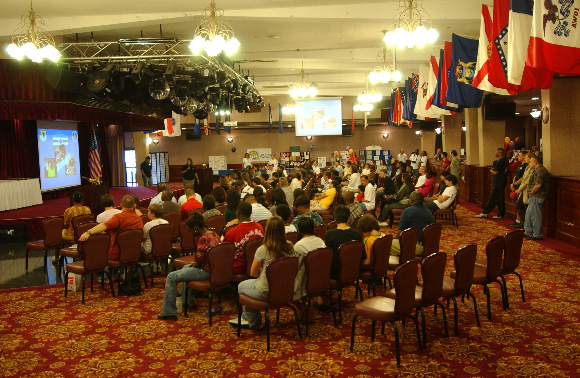 Parents and teens are briefed by representatives from each agency of the opportunities being offered during Teen Summer Expo '08 at the Rocker NCO club, June 7.  
(U.S. Air Force photo/Tech. Sgt. Rey Ramon) 
