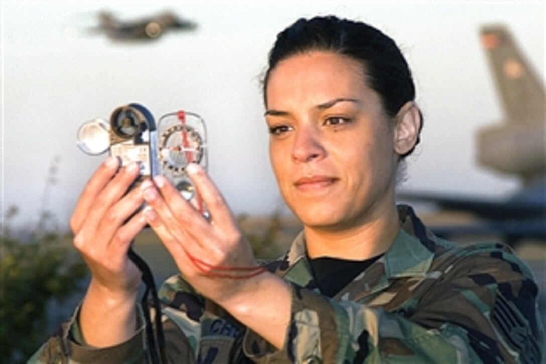 U.S Air Force Staff Sgt. Rebecca Church uses a portable wind meter to take a reading at Travis Air Force Base, Calif., June 5, 2008. The instrument measures wind speed, temperature and atmospheric pressure. Church is a combat weather forecaster assigned to the 60th Operations Support Squadron. 