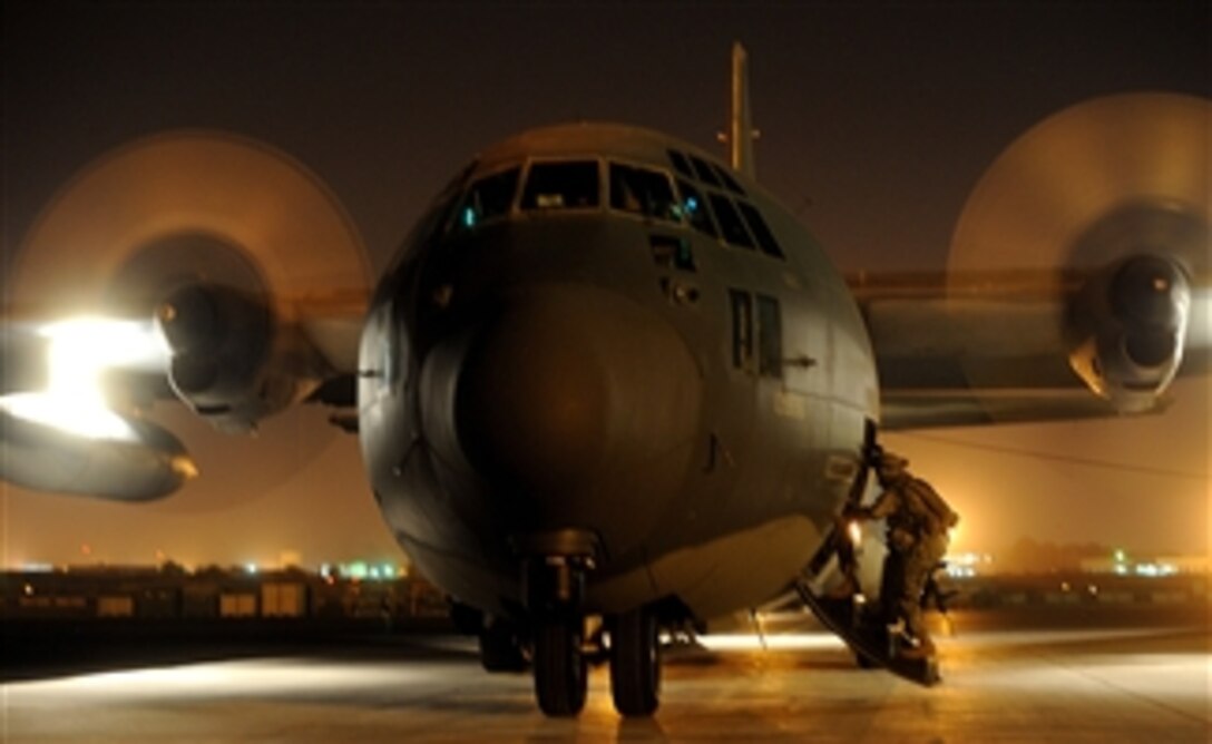 A U.S. Army soldier from the 2nd Battalion, 18th Field Artillery Regiment out of Fort Sill, Okla., deployed in support of Combined Joint Task Force - Horn of Africa boards an HC-130 Hercules aircraft from the 71st Search and Rescue Squadron out of Moody Air Force Base, Ga., to provide security for a medical evacuation at Camp Lemonier, Djibouti, on May 20, 2008.  