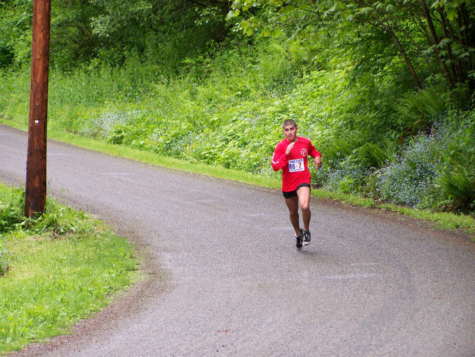 Esteban Granados, 62nd Mission Support Squadron,runs one leg of the June 7 Rainier-to-Ruston race. A team of 12 McChord Airmen finished first and second in the military categories. (U.S. Air Force photo/Sheryl Swory)