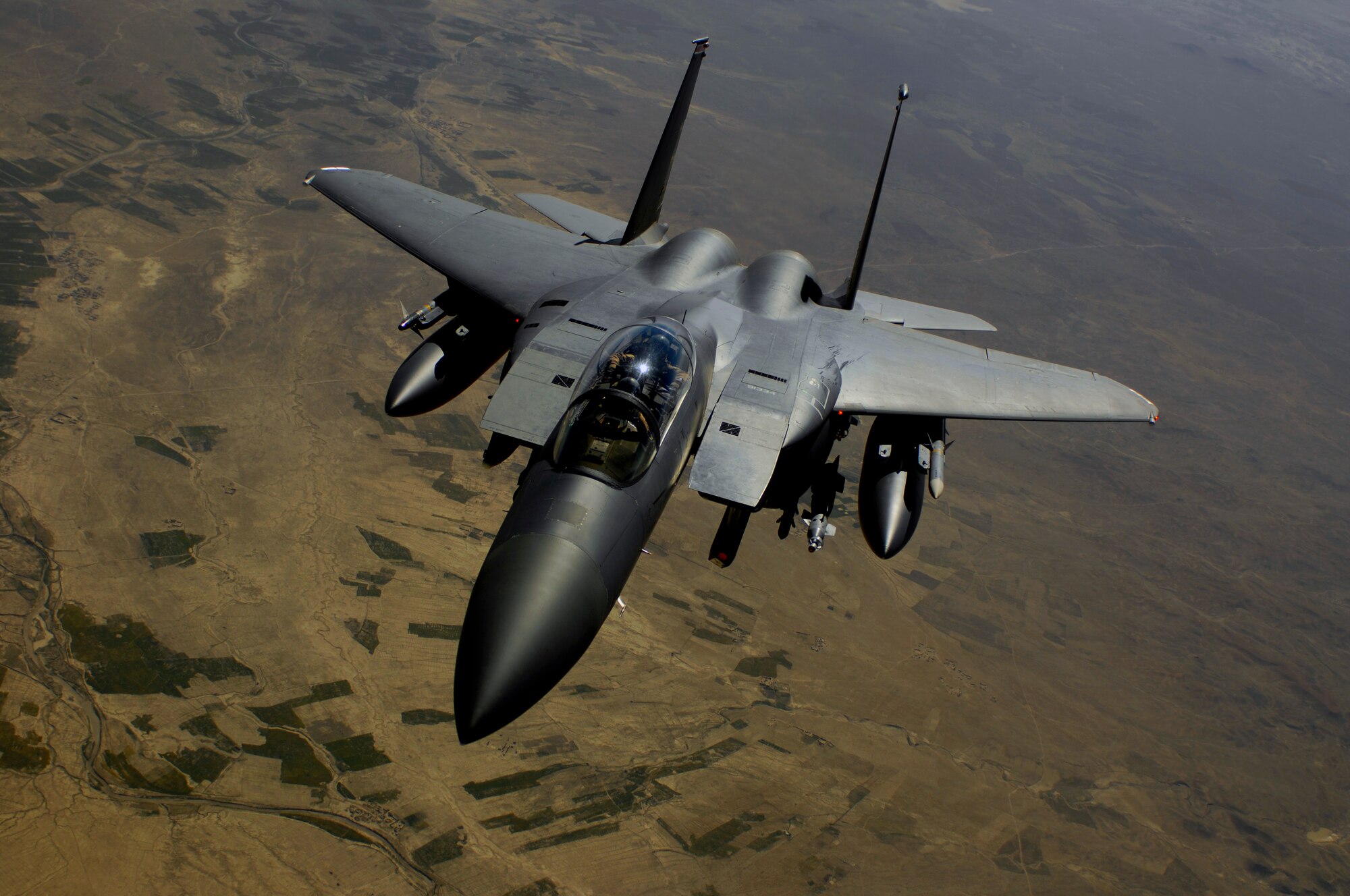 AFGHANISTAN -- A U.S. Air Force F-15E Strike Eagle aircraft returns to the fight after receiving fuel from a KC-135R Stratotanker during a mission over Afghanistan. (U.S. Air Force photo by Master Sgt. Andy Dunaway) (Released)