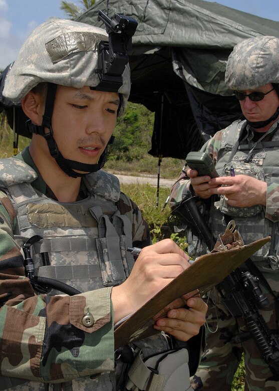 Senior Airman Richard Park (front)  and TSgt Brent Stiefel (back) both from the 18th Security Forces Suadron, Kadena Air Base, Japan, plot points on the range card during PACAF's Commando Warrior on June 14 at Andy South here. During the range card activity fire team members plot substantial terrain trademarks like hills, mountains, and buildings.  Commando Warrior is a seven day pre-deployment training for PACAF's Security Forces airmen hosted by the 736th Security Forces Squadron, Andersen AFB, Guam. (U.S. Air Force photo by Airman 1st Class Nichelle Griffiths)


