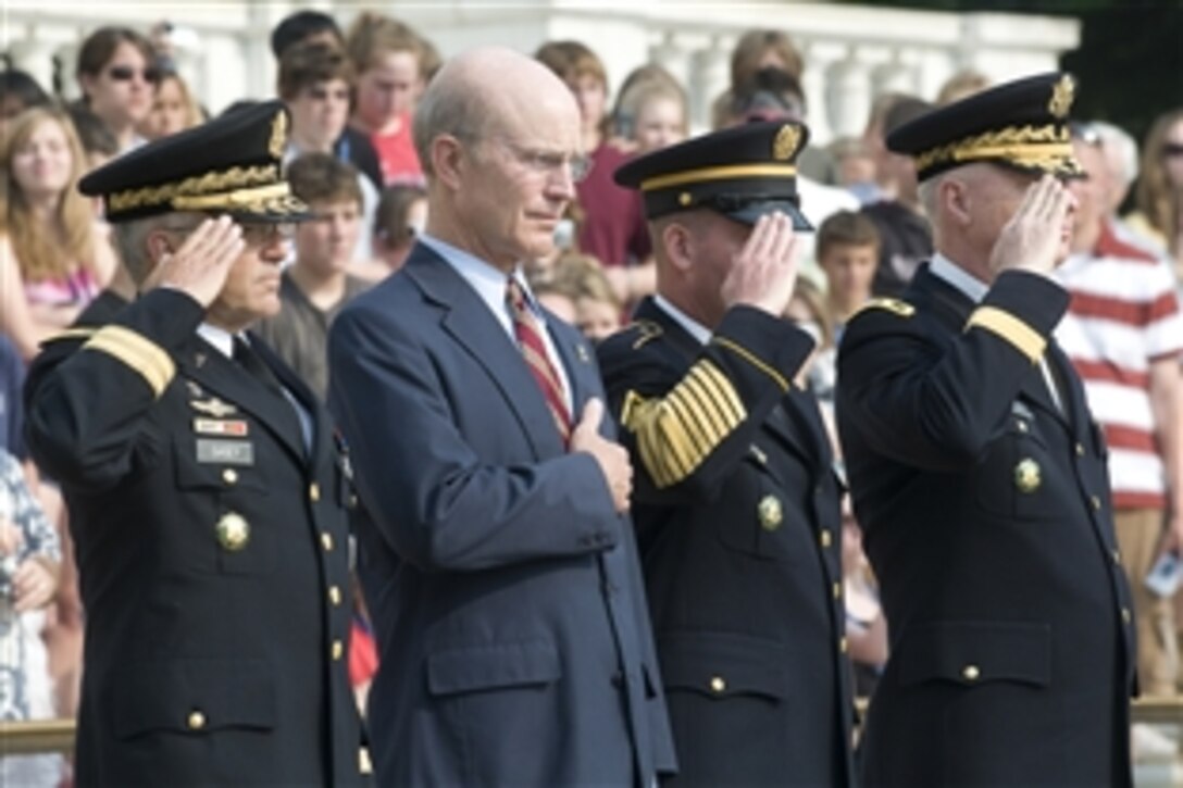 From left: Army Chief of Staff Gen. George Casey, Army Secretary Pete Geren, Sgt. Maj. of the Army Kenneth Preston and Army Maj. Gen. Galen Jackman salute while Taps is played for the Army's 233rd birthday tribute at Arlington National Cemetery, Va., June 14, 2008. 
