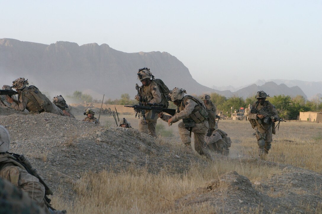Marines with Company F, 2nd Battalion, 7th Marines, get ready to attack a Taliban stronghold in Now Zad, Afghanistan, on June 15, 2008. Marines with 2nd Battalion, 7th Marines, are based out of Marine Air Ground Combat Center Twentynine Palms, Calif. The unit is a reinforced light infantry battalion deployed to Afghanistan in support of Operation Enduring Freedom.