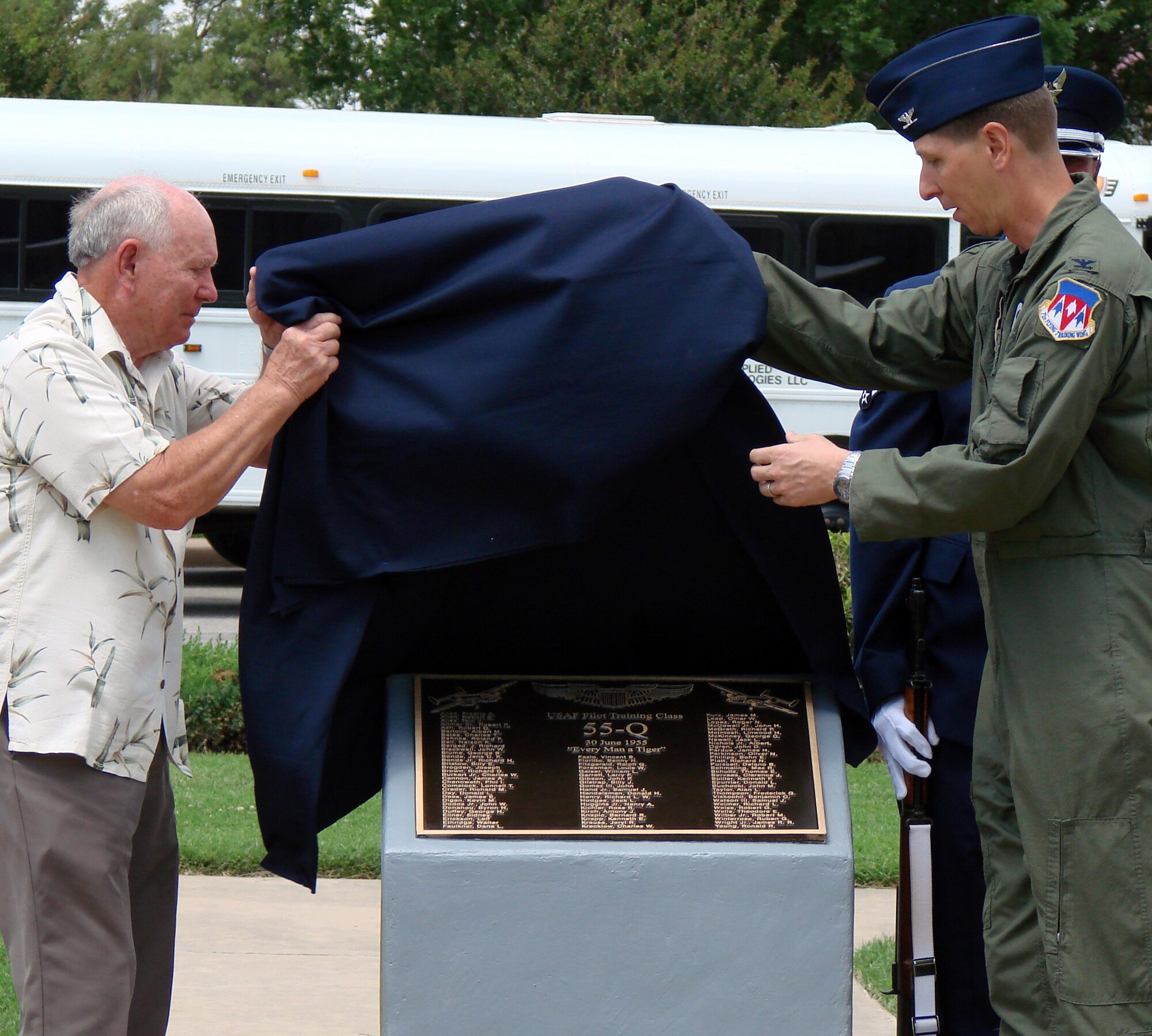 Albert Nichols, a member of Class 55-Q, left, and Col. Richard A. Klumpp Jr., 71st Flying Training Wing commander, unveil a memorial plaque during a ceremony held June 12 here. The plaque contains the names of all 84 members of 55-Q who received multi-engine training in the TB-25 at Vance Air Force Base in 1955. (U.S. Air Force photo by Joe B. Wiles)
