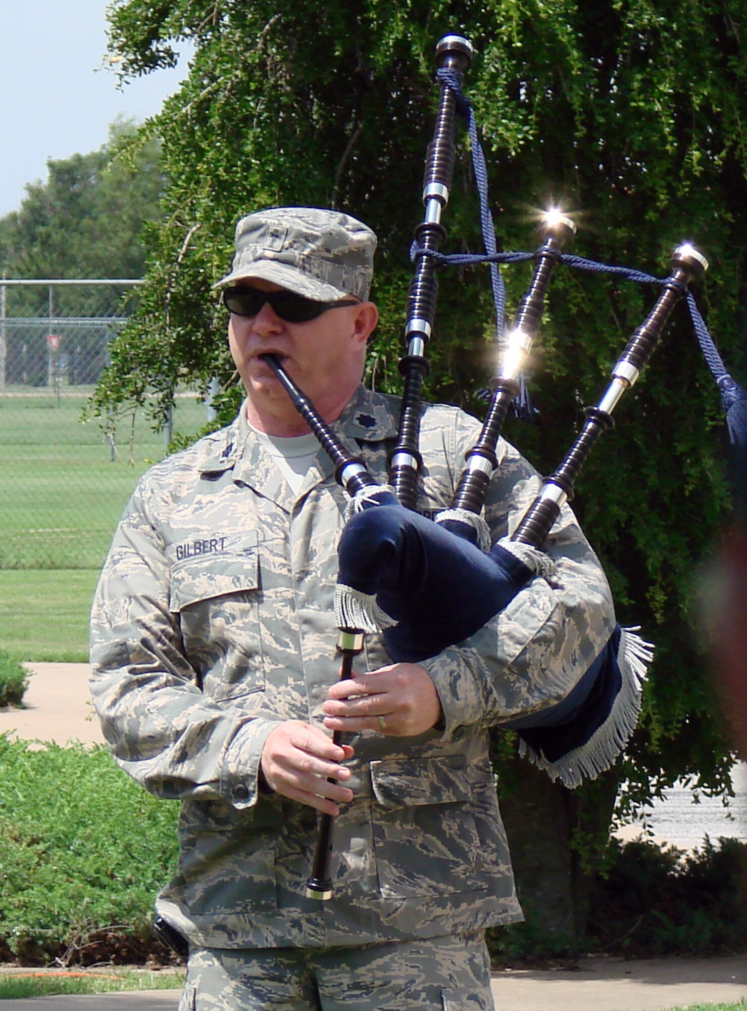 Chaplain (Lt. Col.) Michael Gilbert performs “Amazing Grace” on bagpipe during the Class 55-Q memorial dedication held June 12 at the air park on base. Twenty-five members of 55-Q attended the ceremony as part of their class reunion. (U.S. Air Force photo by Joe B. Wiles)