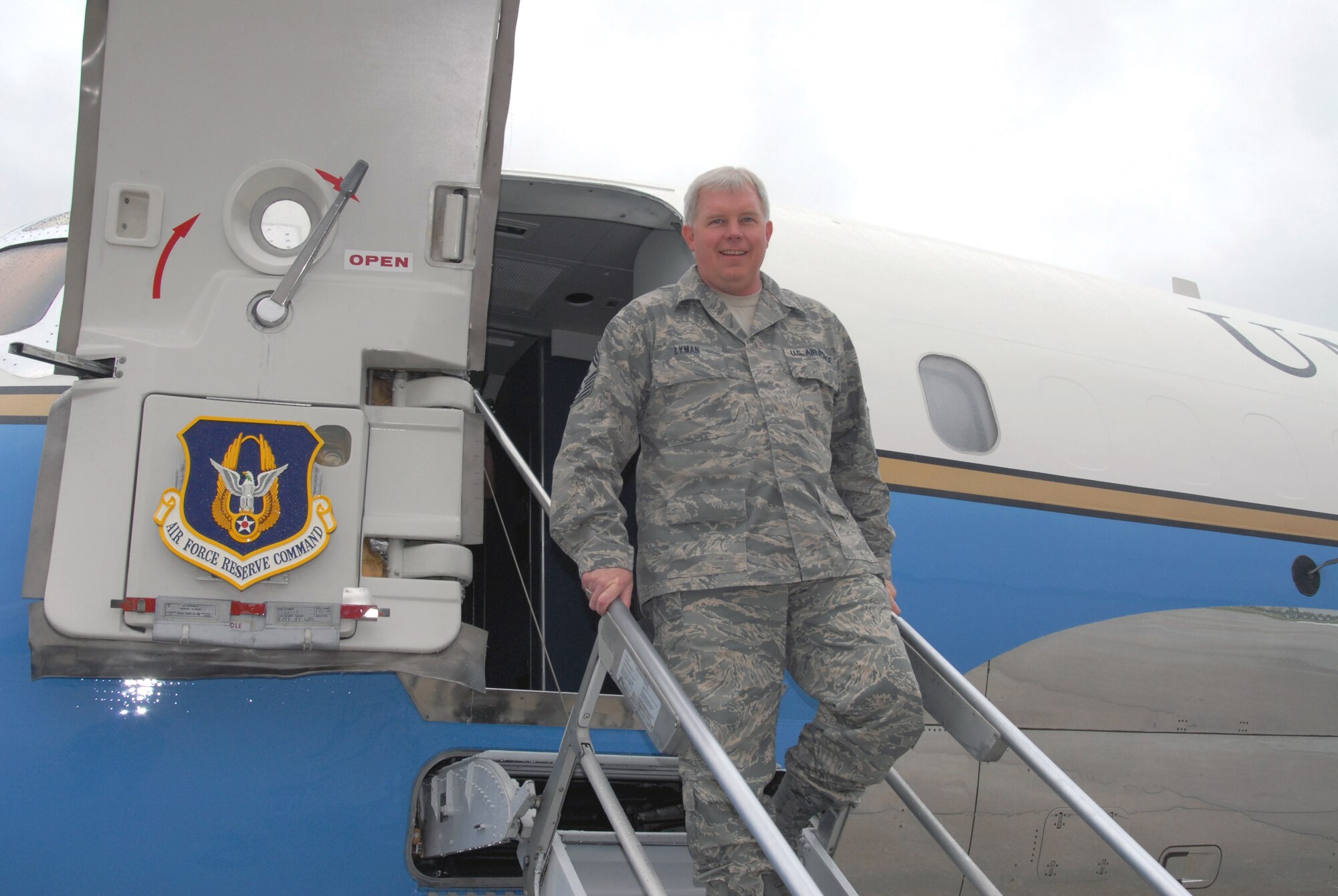 Command Chief Master Sgt. Merle Lyman pauses aboard the 932nd Airlift Wing's distinguished visitor aircraft before his final flight. Photo by Maj. Stan Paregien