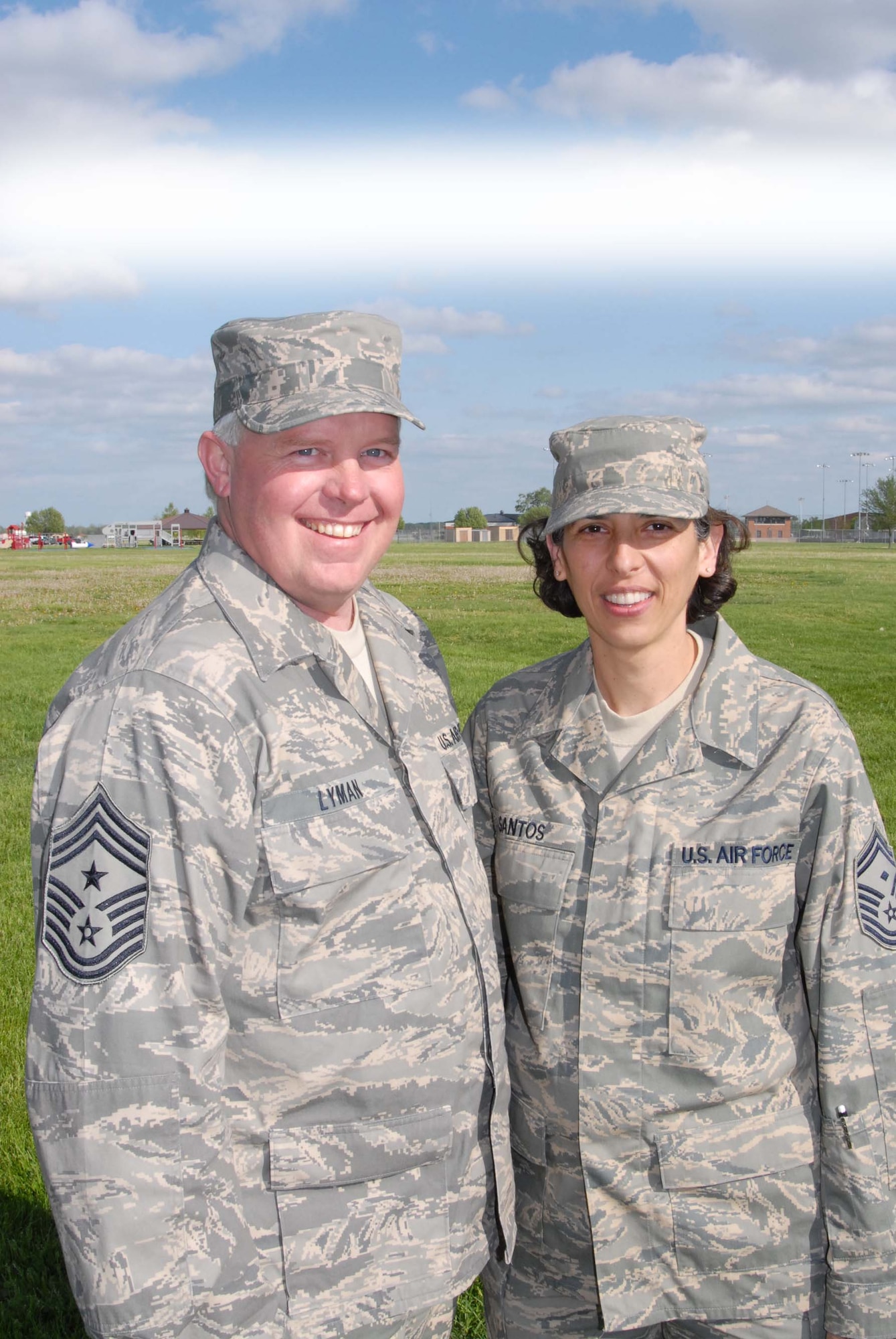 Command Chief Master Sgt. Merle Lyman and Senior Master Sgt. Sandra Santos say farewell to each other as he retired and she was named to be his successor at the 932nd Airlift Wing, Air Force Reserve Command.  Photo/Maj. Stan Paregien