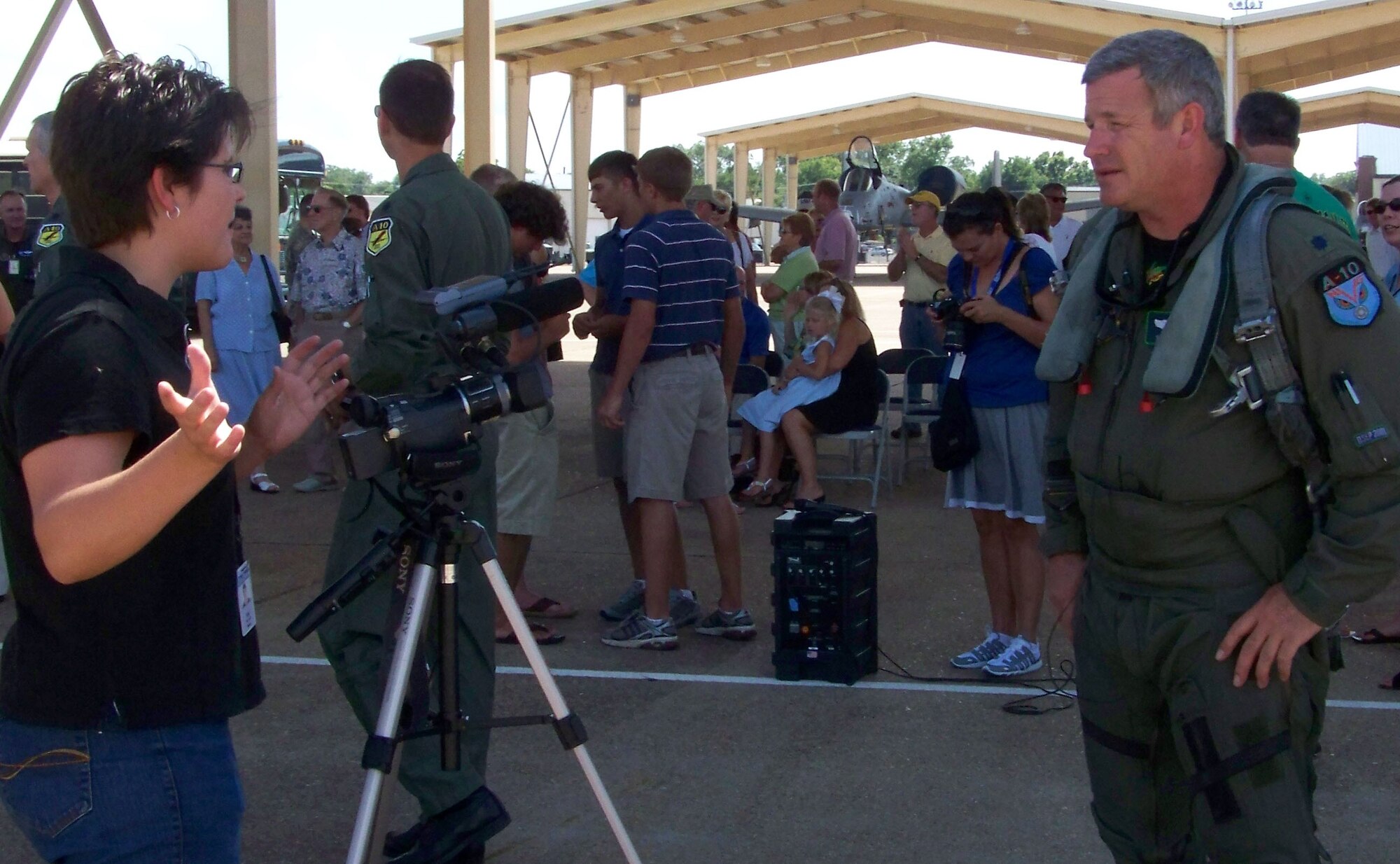 Lt. Col. Marc "Thor" Olson, 47th Fighter Squadron, talks with Shreveport Times videographer, Valerie Horvath, after completing more than 4,000 hours in the A-10 aircraft. At the completion of this historic flight, Lt. Col. Brady Glick, 47 FS, accumulated a career total of 4,666 flying hours (2,495 sorties); Lt. Col. Jimbo Macaulay, 47 FS, accumulated a career total of 4,551 flying hours (2,560 sorties); Lt. Col. Dave Deaton accumulated a craeer total of 4,430 flying hours (2,720 sorties); and Colonel Olson accumulated a career total of 4,093 flying hours (2,239 sorties). (U.S. Air Force photo/Master Sgt. Sherri Bohannon)
