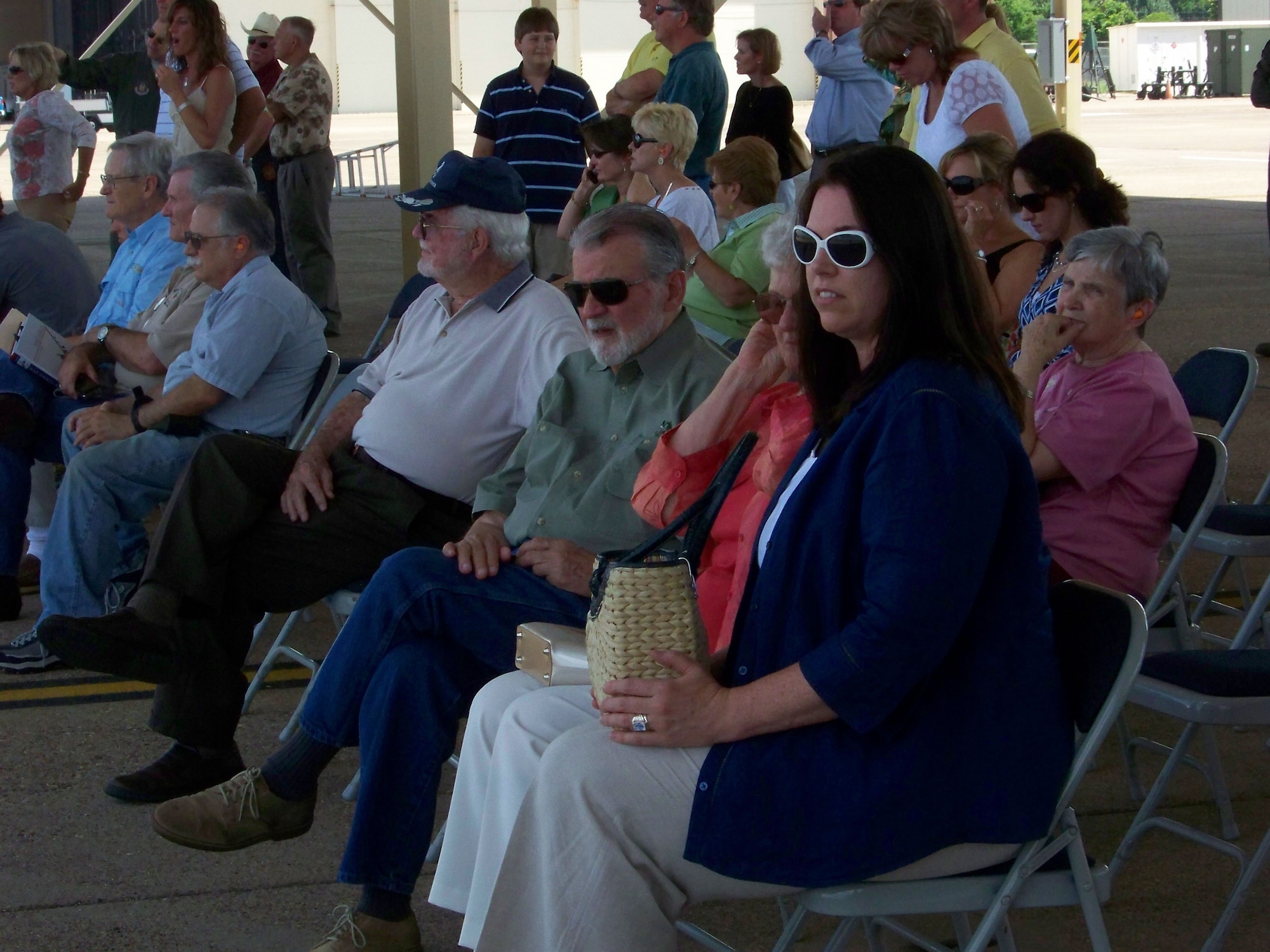 A crowd of family, friends, commanders, past and present, and local Shreveport-Bossier community leaders await the return of a historic 47th Fighter Squadron flight Friday, June 13, Barksdale AFB, La. At the completion of this historic flight, Lt. Col. Brady Glick, 47 FS, accumulated a career total of 4,666 flying hours (2,495 sorties); Lt. Col. Jimbo Macaulay, 47 FS, accumulated a career total of 4,551 flying hours (2,560 sorties); Lt. Col. Dave Deaton accumulated a craeer total of 4,430 flying hours (2,720 sorties); and Colonel Olson accumulated a career total of 4,093 flying hours (2,239 sorties). (U.S. Air Force photo/Master Sgt. Sherri Bohannon)