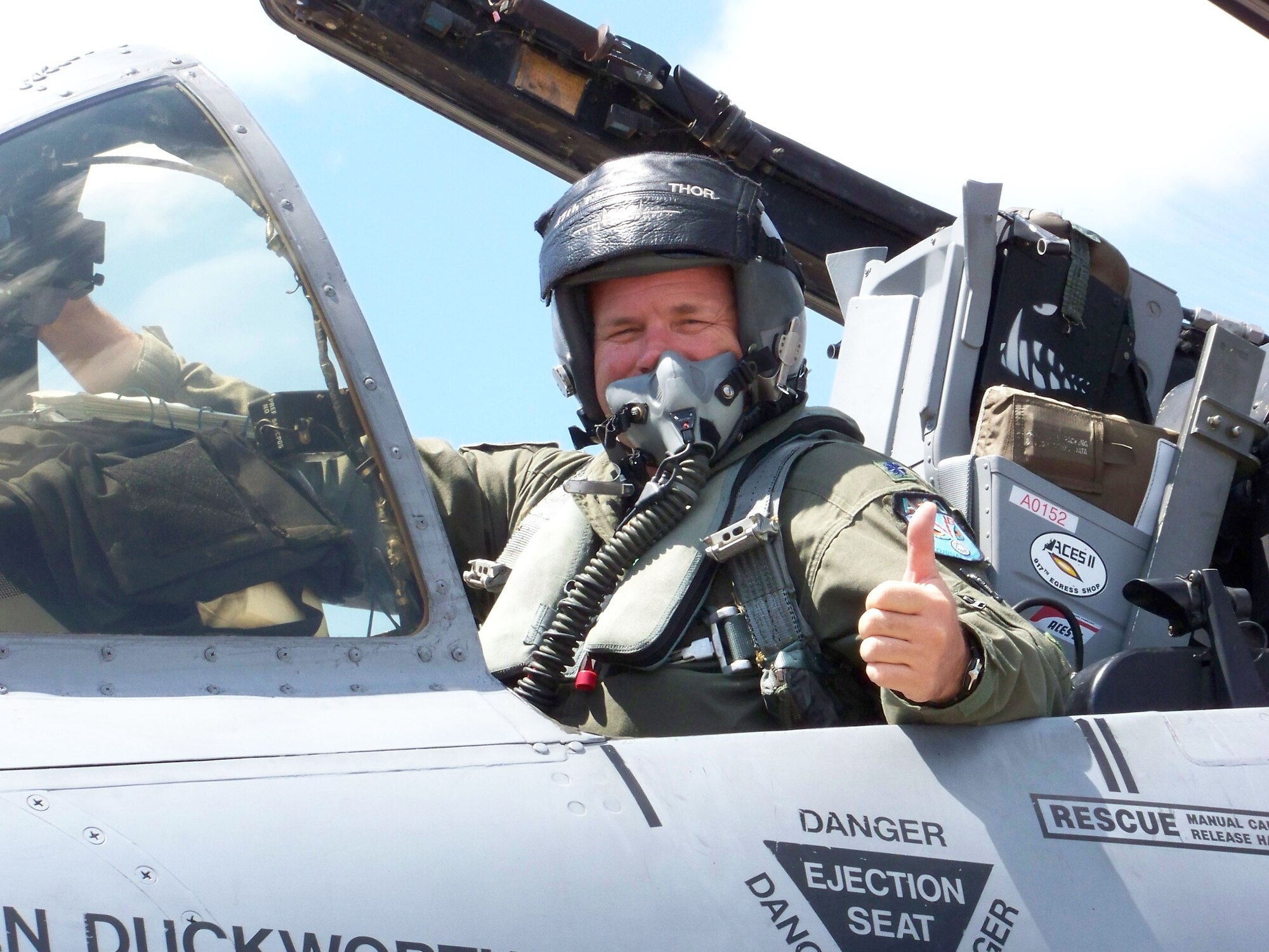 Lt. Col. Marc "Thor" Olson, 47th Fighter Squadron, gives a thumbs-up after crossing the 4,000 flying-hour mark Friday, June 13, Barksdale AFB, La. Colonel Olson was one of four pilots to participate in a record-setting flight Friday. At the completion of this historica flight, Lt. Col. Brady Glick, 47 FS, accumulated a career total of 4,666 flying hours (2,495 sorties); Lt. Col. Jimbo Macaulay, 47 FS, accumulated a career total of 4,551 flying hours (2,560 sorties); Lt. Col. Dave Deaton accumulated a craeer total of 4,430 flying hours (2,720 sorties); and Colonel Olson accumulated a career total of 4,093 flying hours (2,239 sorties). (U.S. Air Force photo/Master Sgt. Sherri Bohannon)