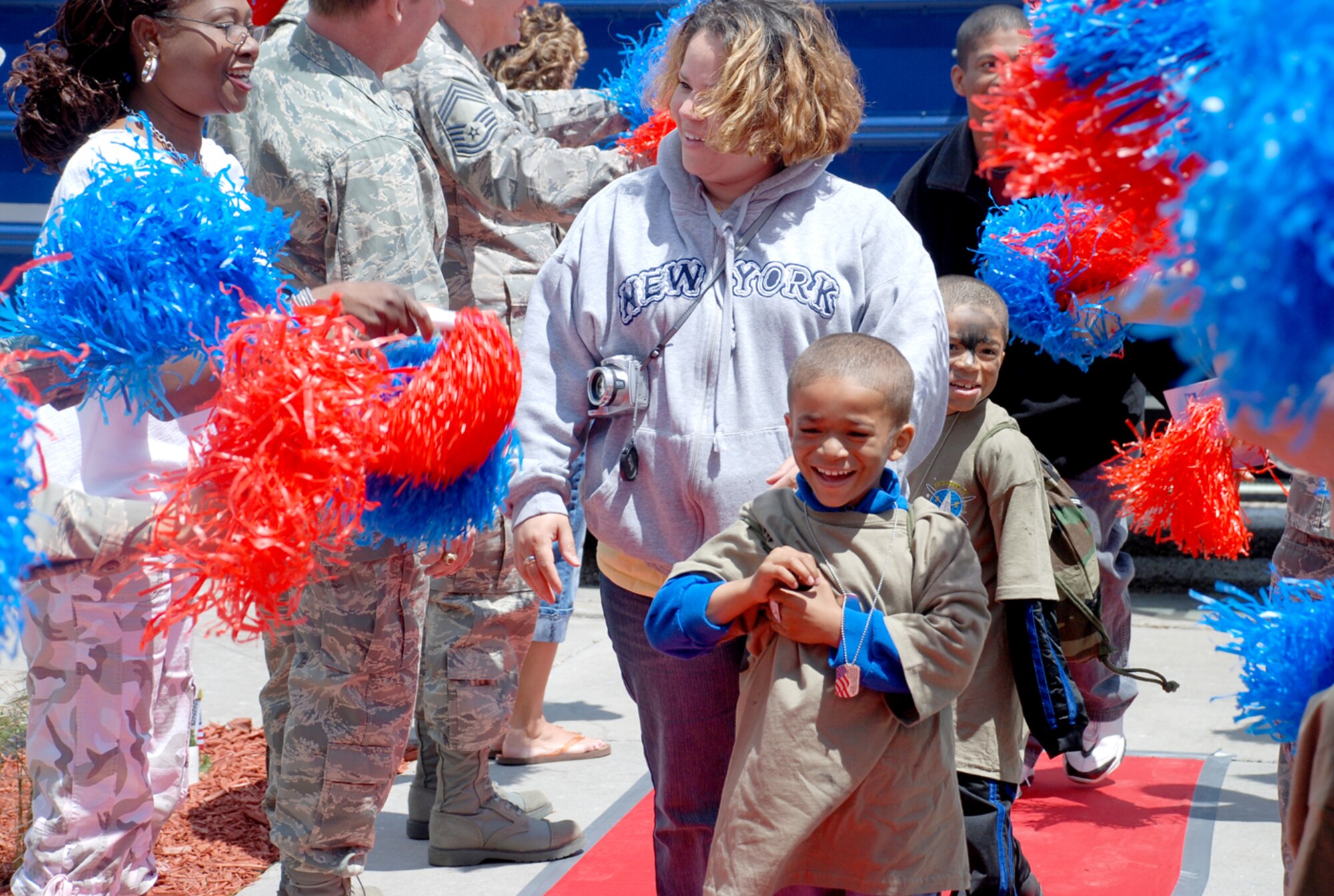 Jr. Deployer participants arrive at the youth center for a welcome home celebration. The children were out-briefed, and cake and drinks were provided.