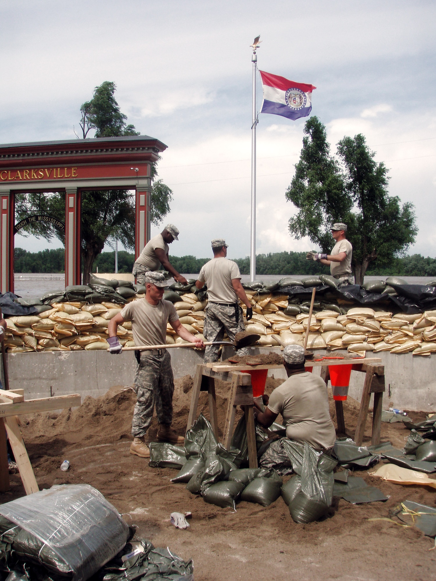 More than 600 National Guardsmen in Illinois and Missouri will continue sandbagging operations along the Mississippi River June 16 in an effort to thwart the floodwaters that are subsiding in Iowa. Guardsmen fill sandbags in Clarksville, Mo., an area expected to recieve more floodwater this week. In Illinois, 400 Soldiers and Airmen were mobilized during the weekend to work on the levees north and south of Quincy, Ill. About 100 Air National Guardsmen from the 183rd Fighter Wing in Springfield, Ill., the 182nd Airlift Wing in Peoria were mobilized June 15. (Missouri National Guard photo/Gary Stevens)