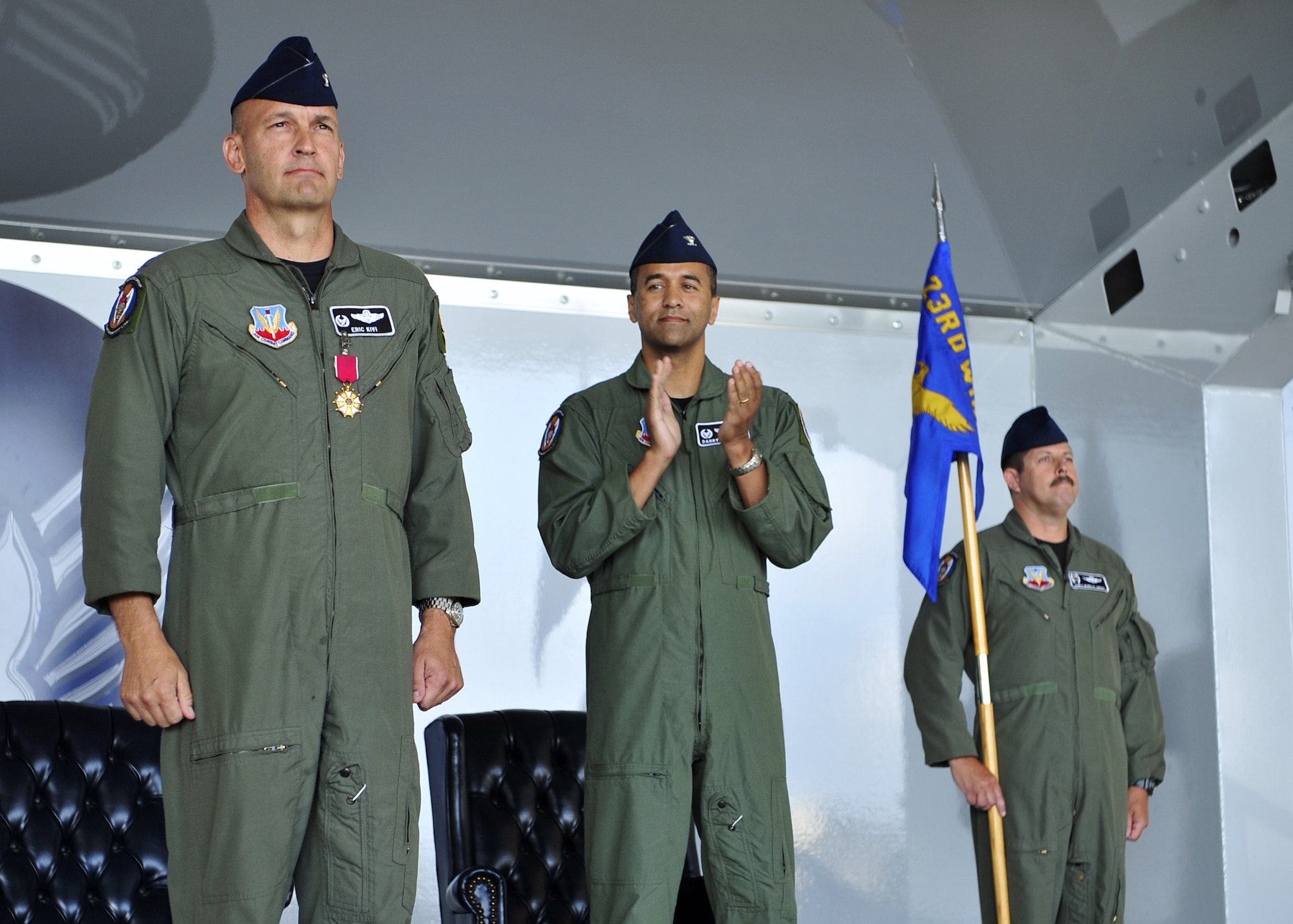 MOODY AIR FORCE BASE, Ga.—Col. Eric Kivi, former 347th Rescue Group commander, receives a Legion of Merit medal as Col. Darryle Grimes, incoming 347th Rescue Group commander, looks on during a change-of-command ceremony here June 13.  The Legion of Merit medal is awarded for exceptional conduct, performance, achievements and services.
