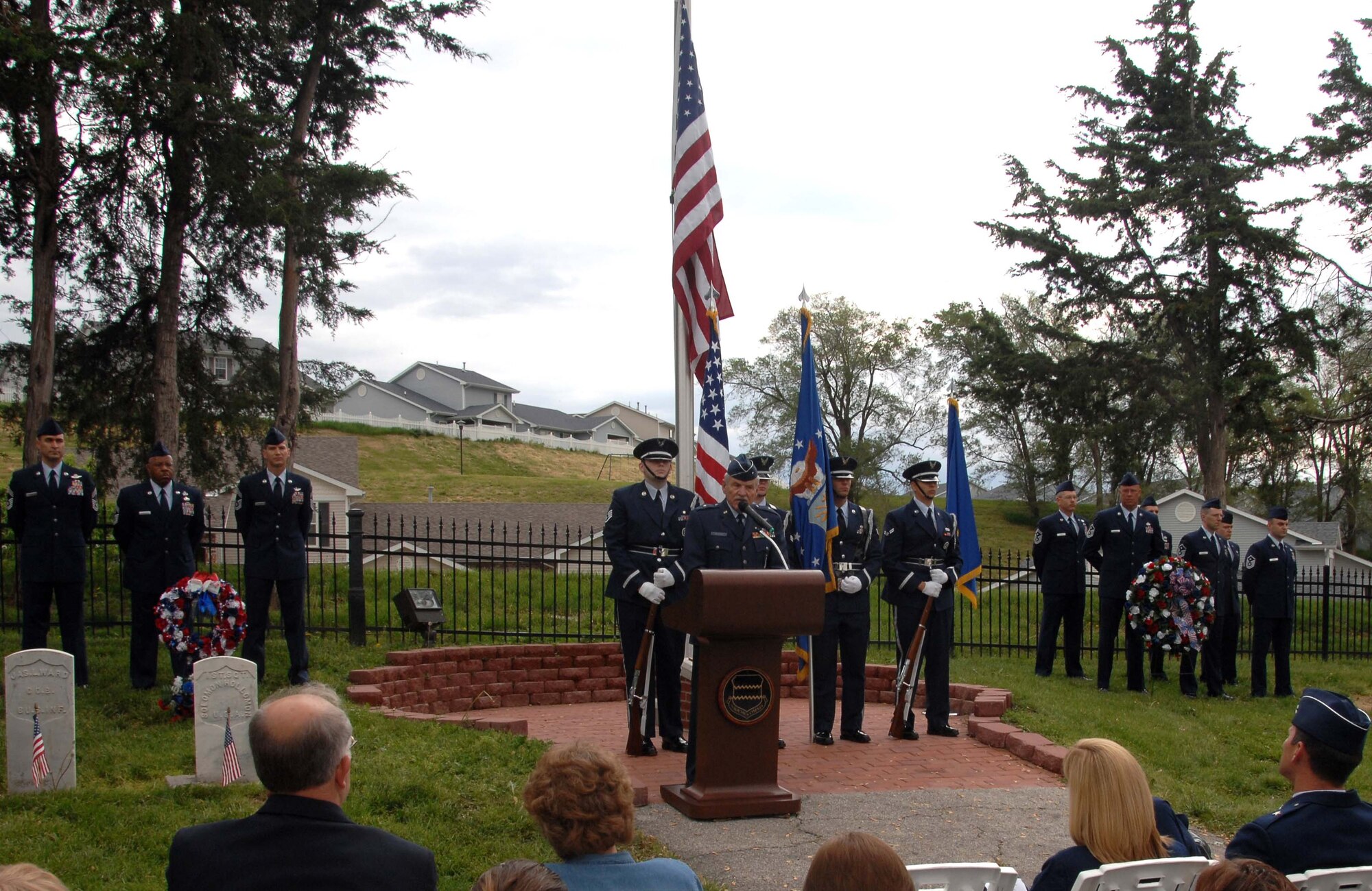 Retired Brig. Gen. Regis Urschler provides a moving speech during a Memorial Day ceremony at Offutt's base cemetery May 26. During his address, the general reminded the more than 100 people gathered of the sacrifices tof those who died for the United States and the ideals and freedoms Americans enjoy today. (U.S. Air Force Photo By/Josh Plueger)