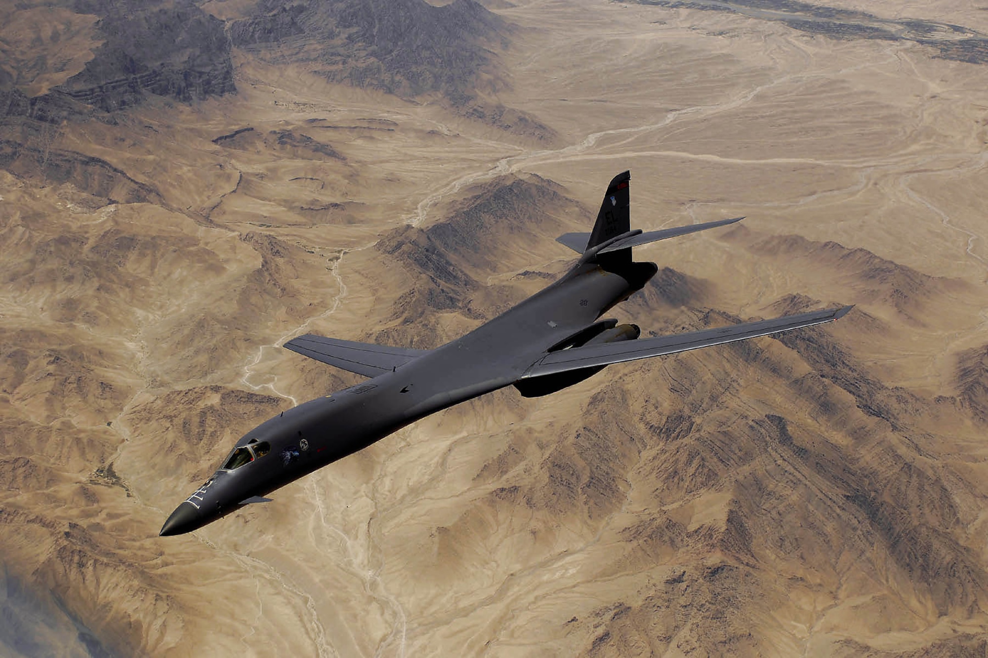 An Air Force B-1B Lancer aircraft moves out of position after receiving fuel from a KC-135R Stratotanker during a mission over Afghanistan. (U.S. Air Force photo/Master Sgt. Andy Dunaway)
