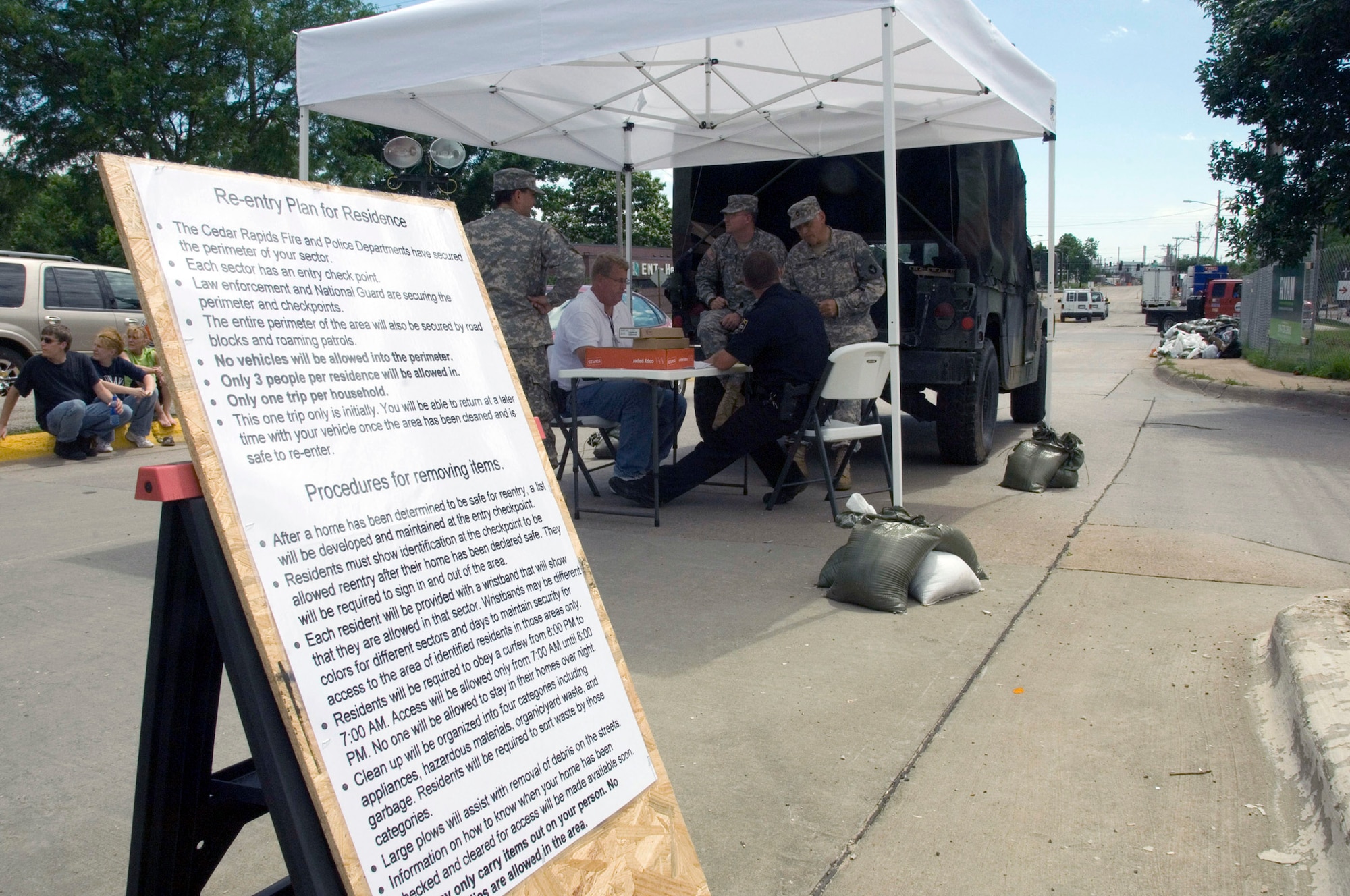 Checkpoints have been set up throughout the flood-damaged areas of Cedar Rapids, Iowa. Once their homes have been inspected and identified as non-hazardous, residents are allowed in on a limited basis to recover personal items and valuables. (U.S. Air Force photo/Master Sgt. Jack Braden) 
