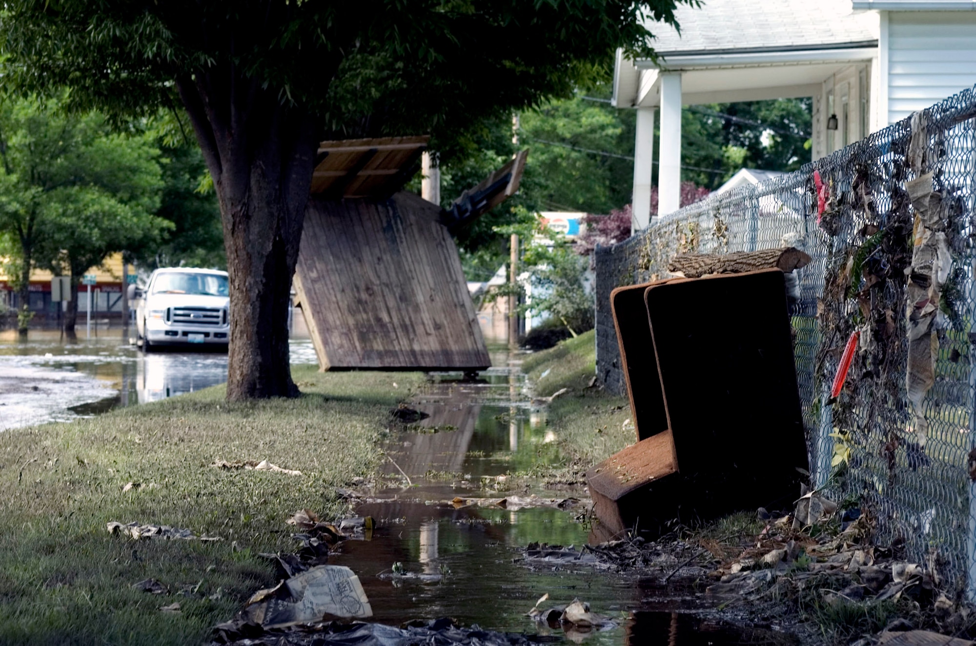 Debris and water surround hundreds of homes June 15 in Cedar Rapids, Iowa. More than 150 Air National Guardsmen arrived in Cedar Rapids to help secure and recover areas that were affected by flood waters. (U.S. Air Force photo/Staff Sgt. Desiree N. Palacios) 