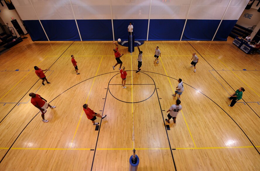 MOODY AIR FORCE BASE, Ga. -- Members of the 23rd Force Support Squadron, left, and members of the 723rd Aircraft Maintenance Squadron, right, play volleyball during the base intramural championship game here June 11. The 723rd AMXS won two out of three games taking the championship. (U.S. Air Force photo by Senior Airman Gina Chiaverotti)
