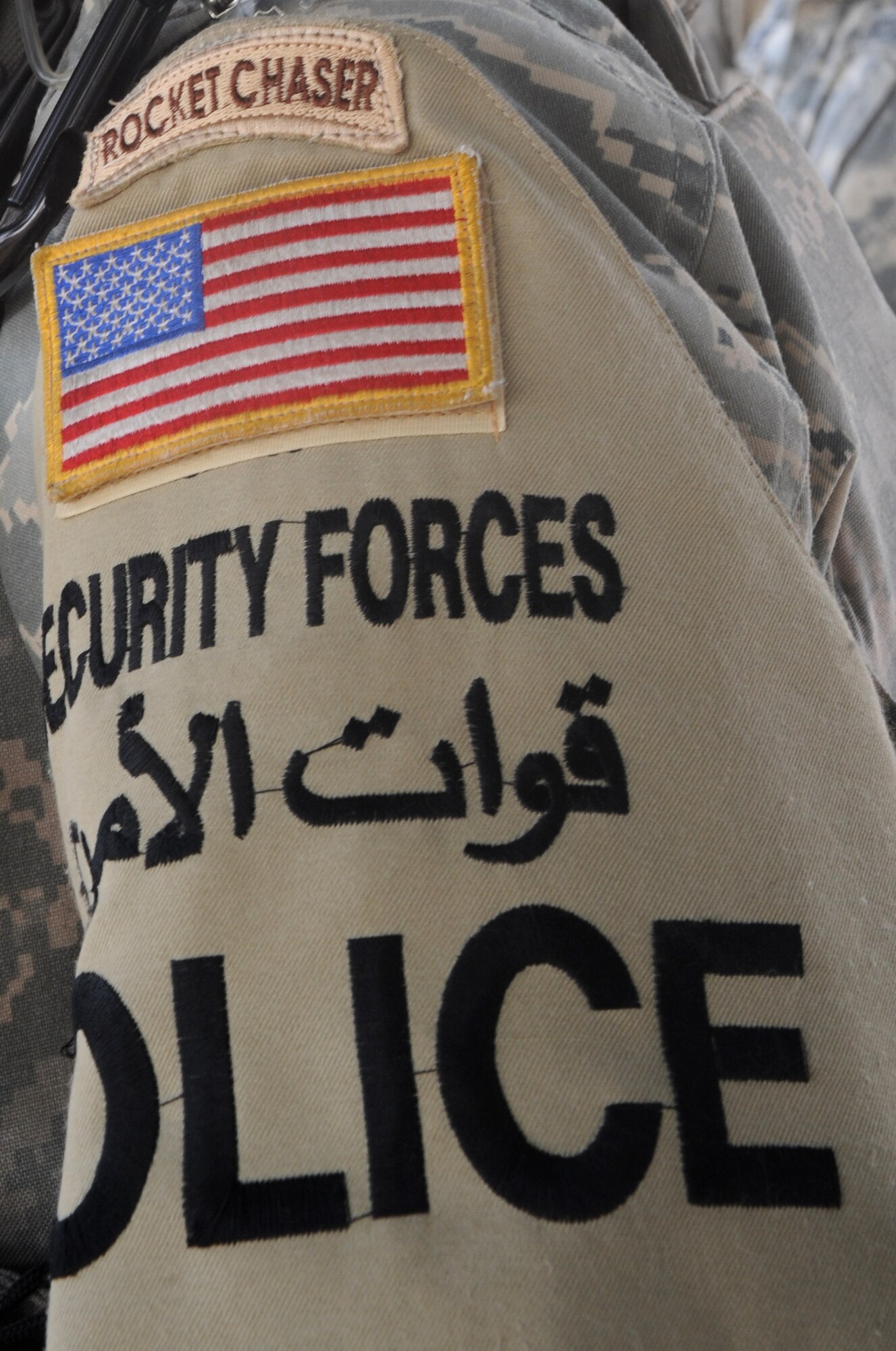 INTERNATIONAL ZONE, Baghdad, Iraq -- Members of the 732nd Expeditionary Security Forces Squadron, Detachment 4, wear their "Rocket Chaser" badge proudly. These defenders are responsible for responding to more than 200 rocket attacks on the International Zone in about five months, as well as providing law and order in the IZ. (U.S. Air Force photo/Tech. Sgt. Amanda Callahan)