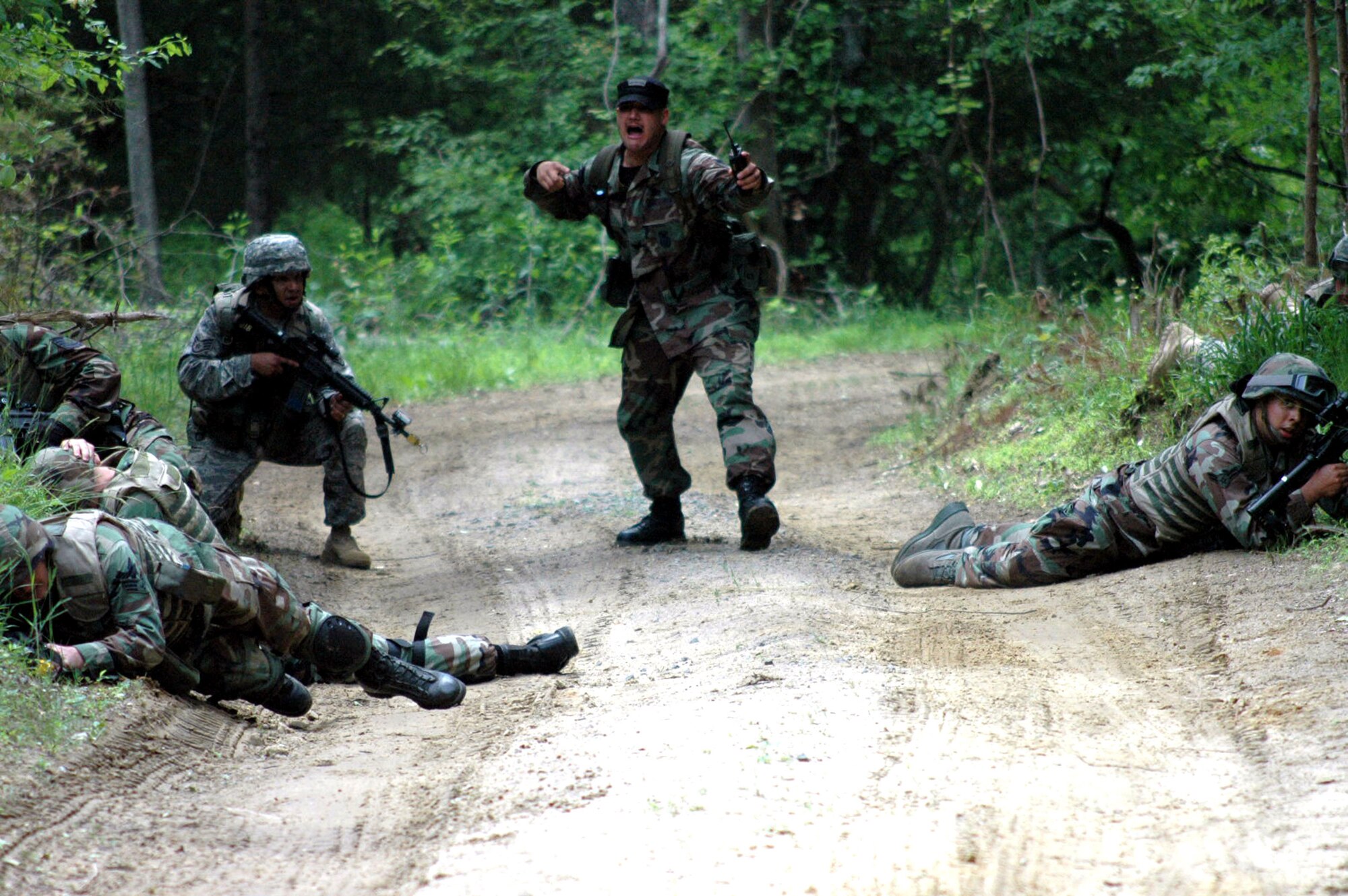 A group of students in the Air Force Phoenix Warrior Training Course 08-5 practice a dismounted patrol during training on a Fort Dix, N.J., range June 6, 2008.  The course, taught by the U.S. Air Force Expeditionary Center's Expeditionary Operations School and 421st Combat Training Squadron, prepares security forces Airmen for upcoming deployments.  (U.S. Air Force Photo/Staff Sgt. Paul R. Evans)