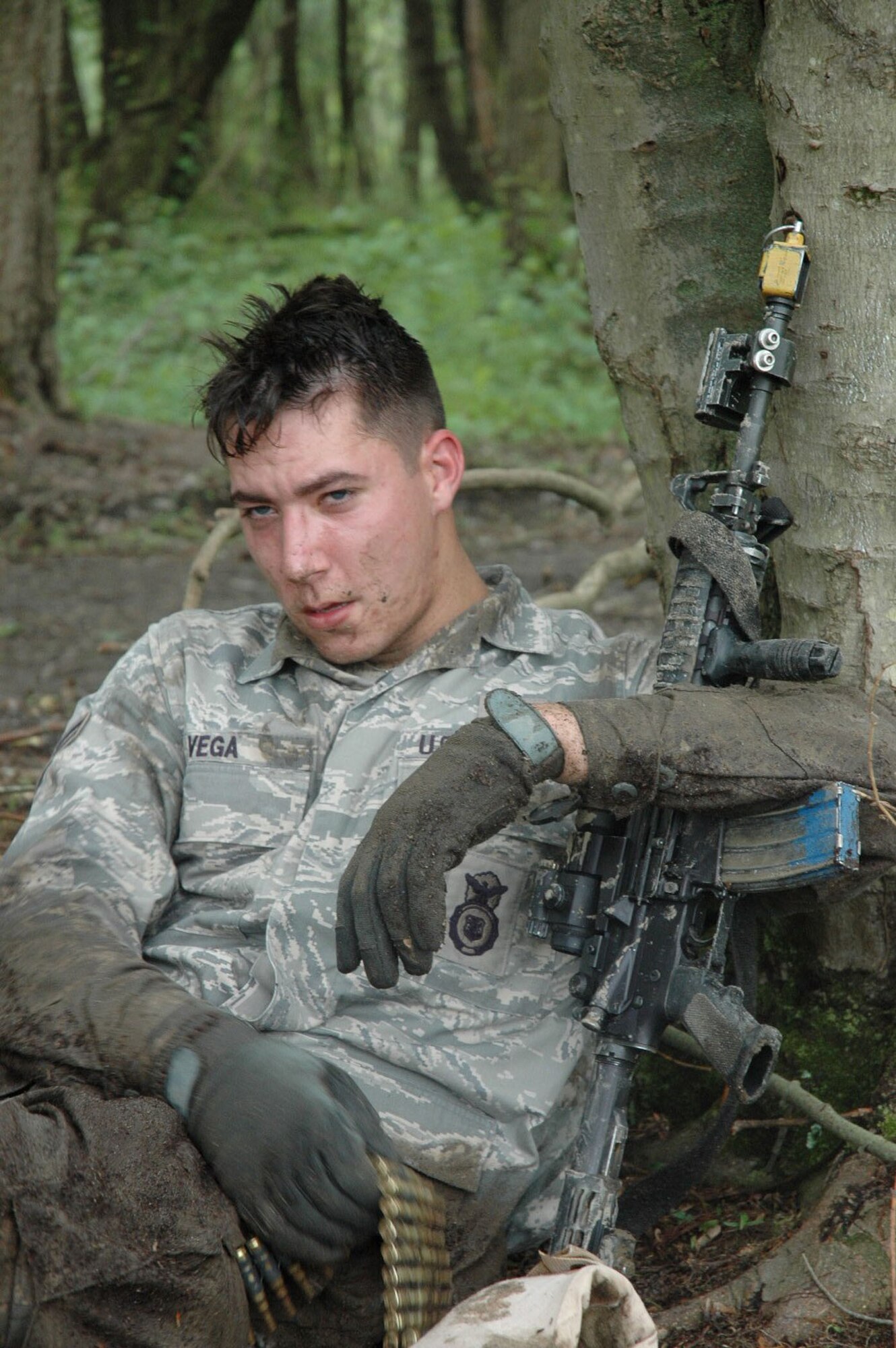 Airman 1st Class John Vega, 30th Security Forces Squadron,  Vandeburg Air Force Base, Calif., takes a rest after he and other students in the Air Force Phoenix Warrior Training Course 08-5 completed a run on an obstacle course for a combat first aid class on a Fort Dix, N.J., range June 5, 2008.  Phoenix Warrior trains security forces Airmen for upcoming deployments and is operated by the U.S. Air Force Expeditionary Center's Expeditionary Operations School and 421st Combat Training Squadron.  (U.S. Air Force Photo/Staff Sgt. Paul R. Evans)